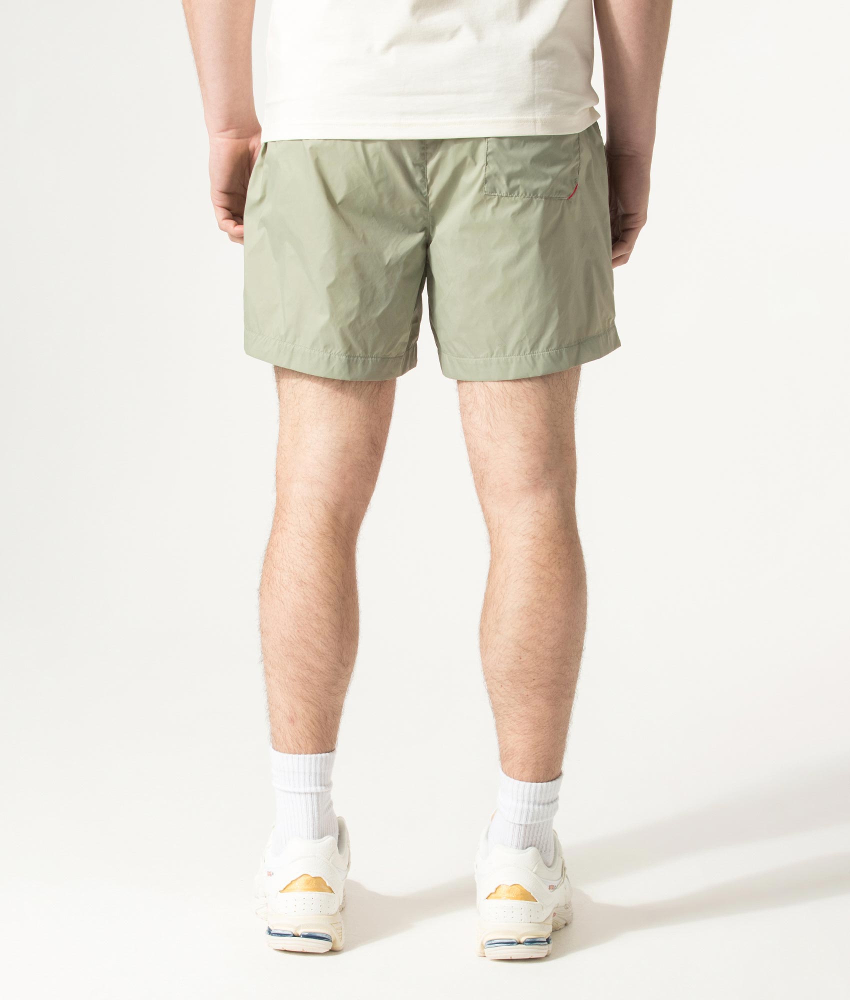HUGO HAITI Swim Shorts in Dark Green at EQVVS Menswear. Model back shot.