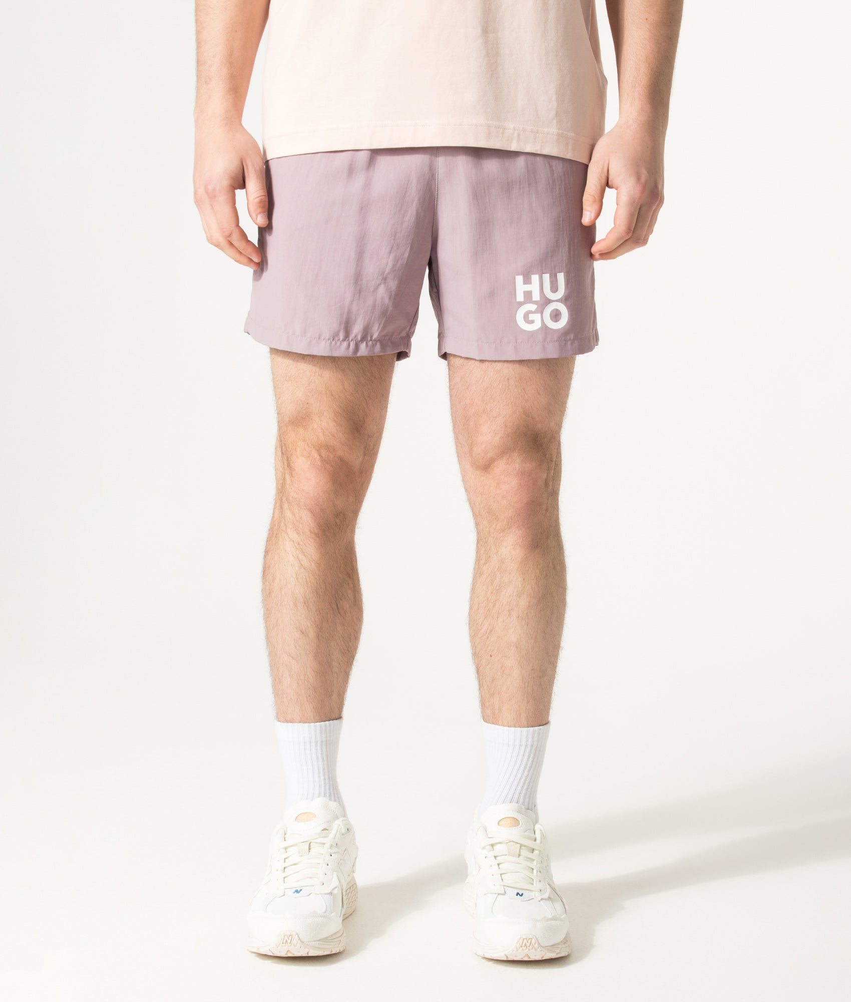 HUGO PAOLO Swim Shorts in Light/Pastel Pink at EQVVS Menswear. Model front shot.