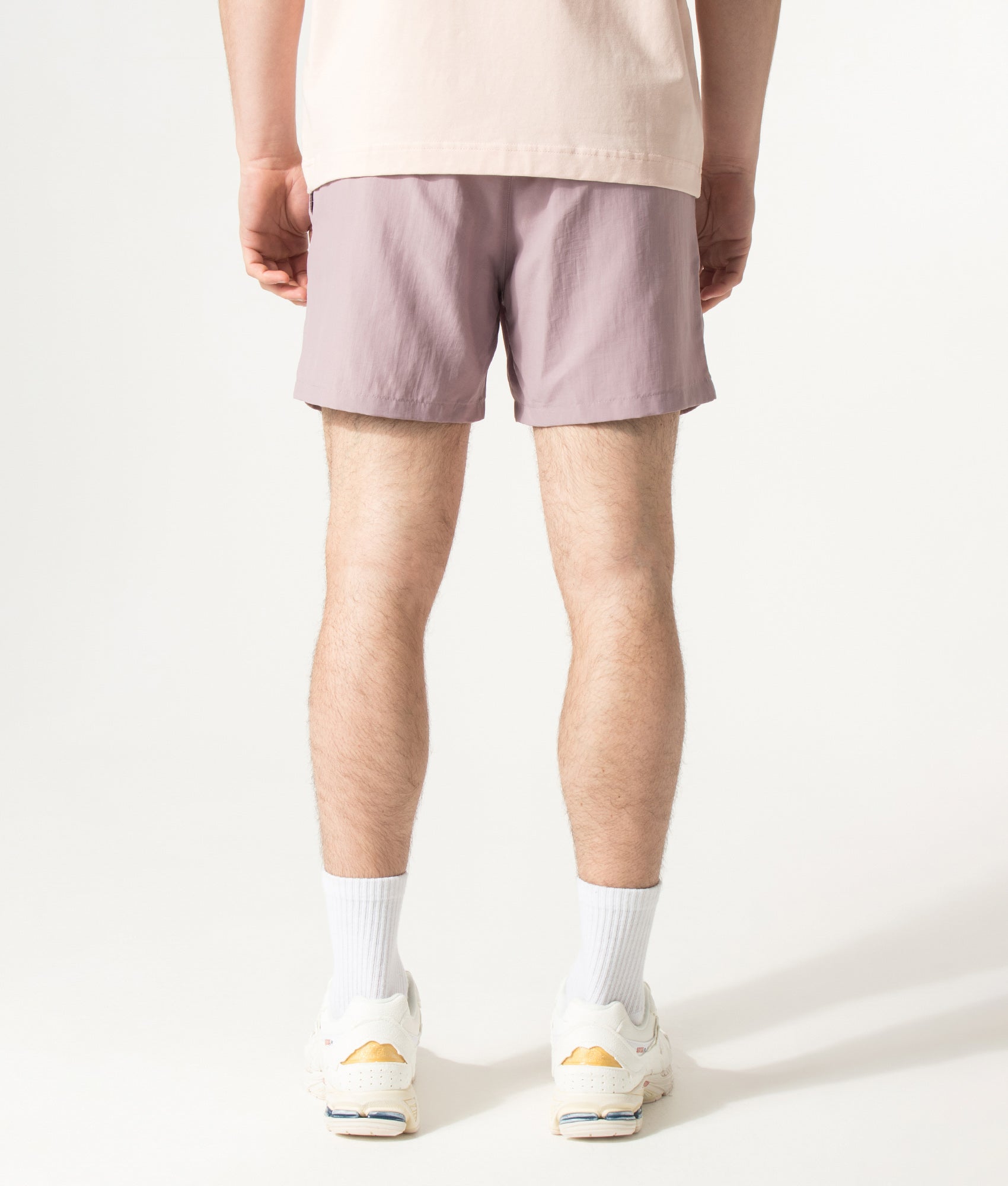 HUGO PAOLO Swim Shorts in Light/Pastel Pink at EQVVS Menswear. Model back shot.
