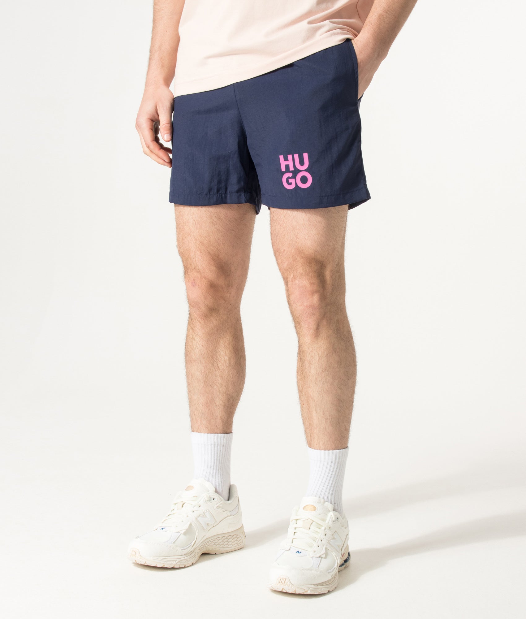 HUGO PAOLO Swim Shorts in Navy at EQVVS Menswear. Angled model front shot.