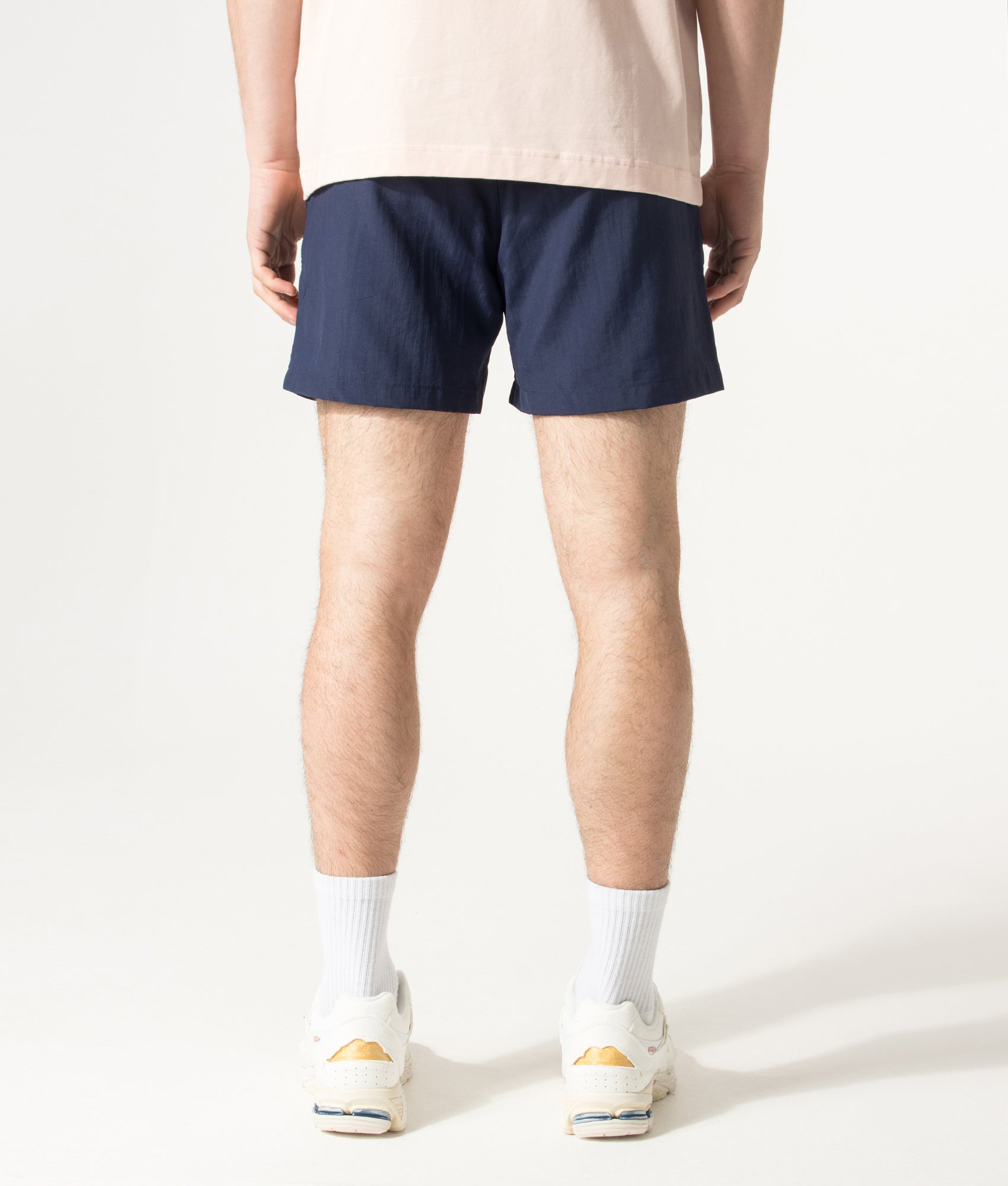 HUGO PAOLO Swim Shorts in Navy at EQVVS Menswear. Model back shot.