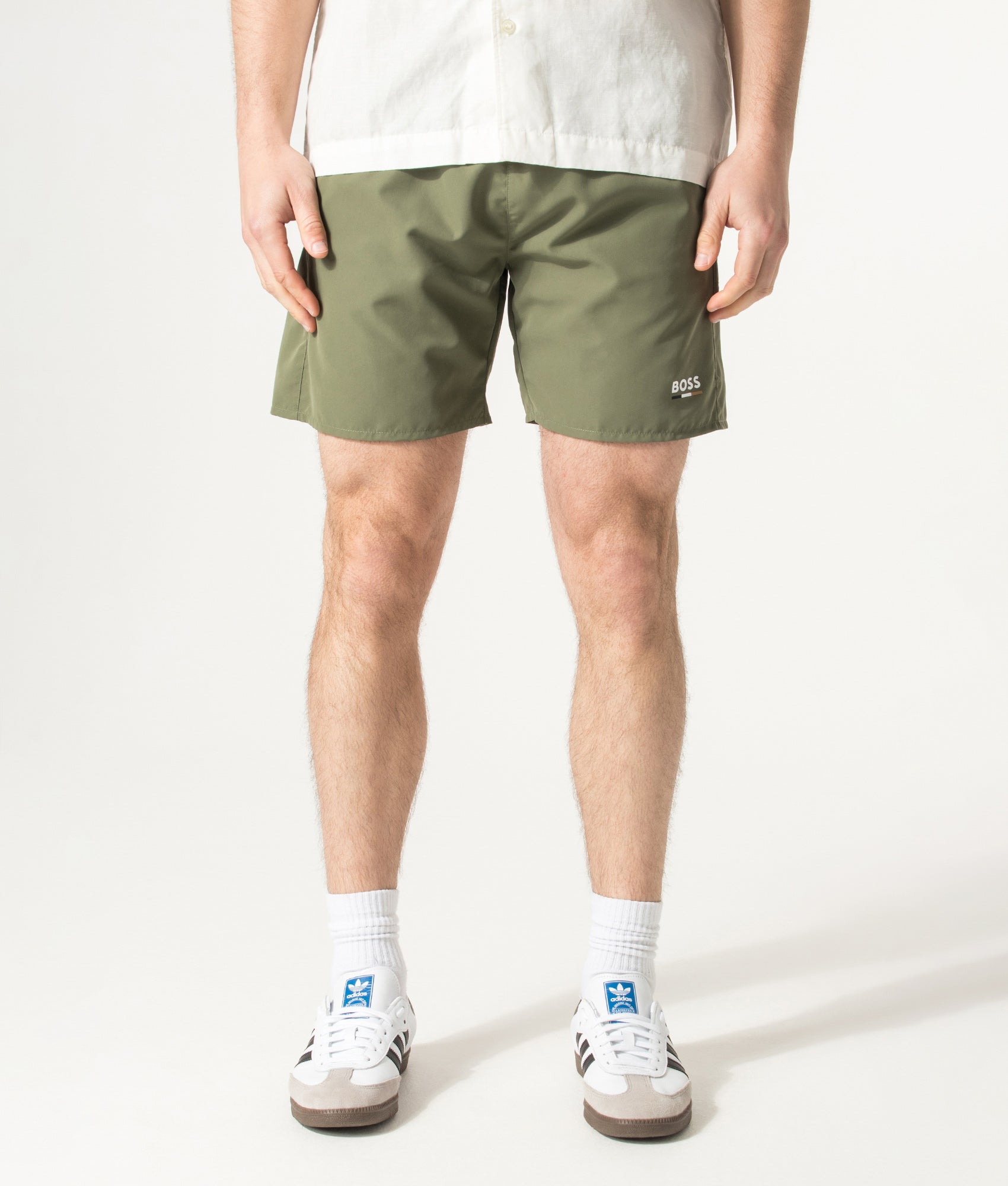 BOSS Swordfish Swim Shorts in Open Green at EQVVS Menswear. Model front shot.