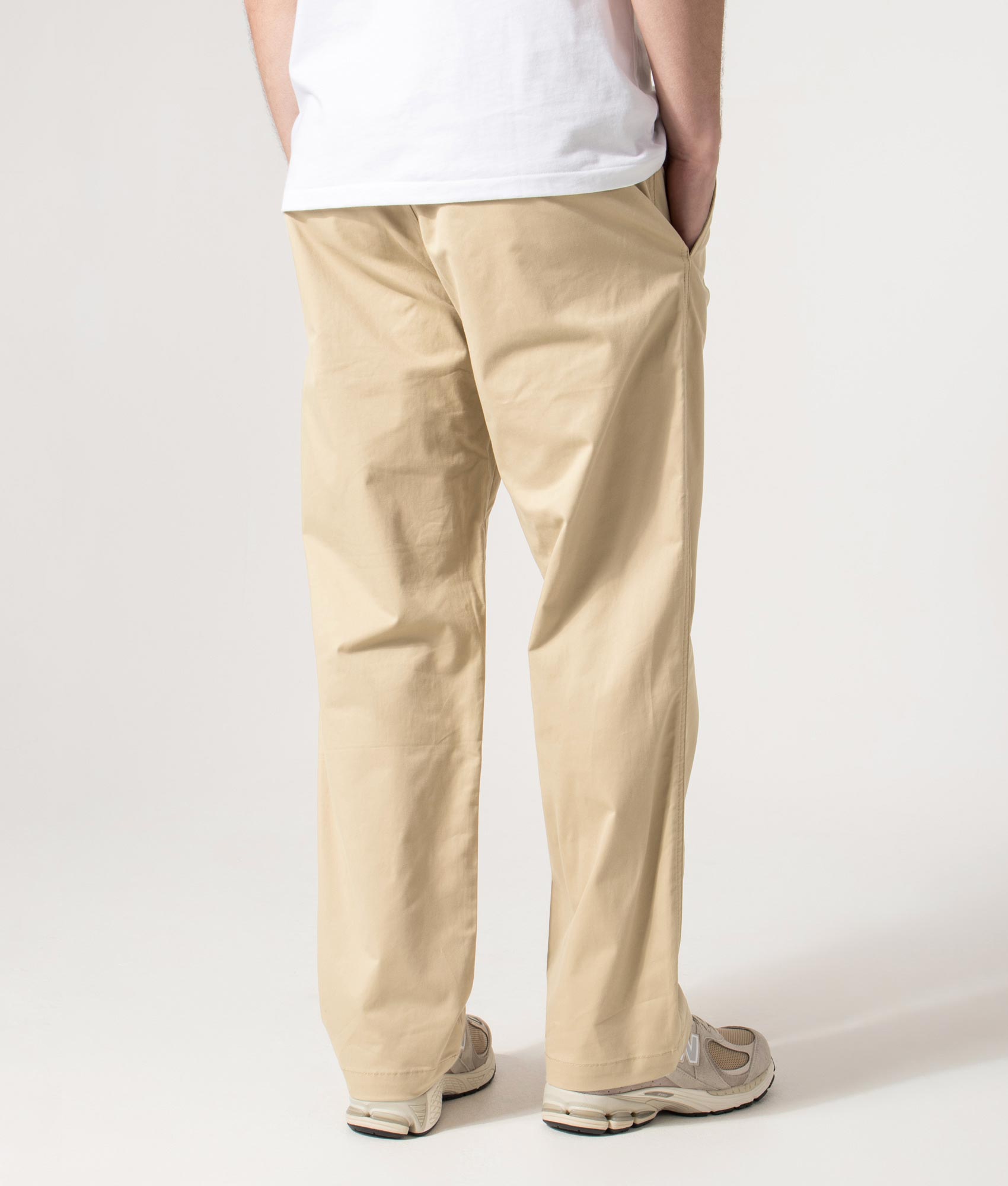 HUGO Regular Fit Straight Leg Cino261 Trousers in Medium Beige at EQVVS Menswear. Angled model back shot.