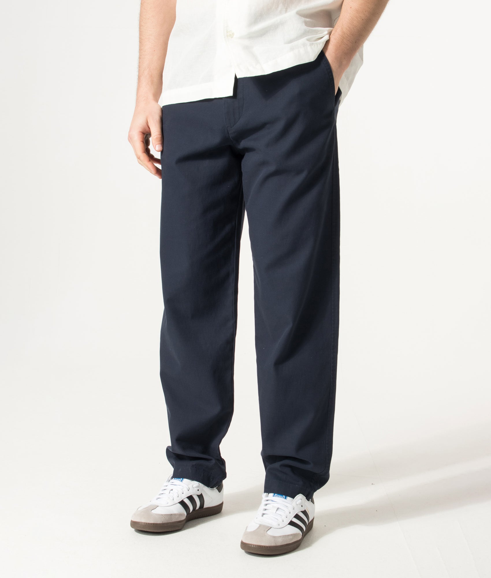 Chinos in Dark Blue by BOSS. Shot by EQVVS. Front angled shot.