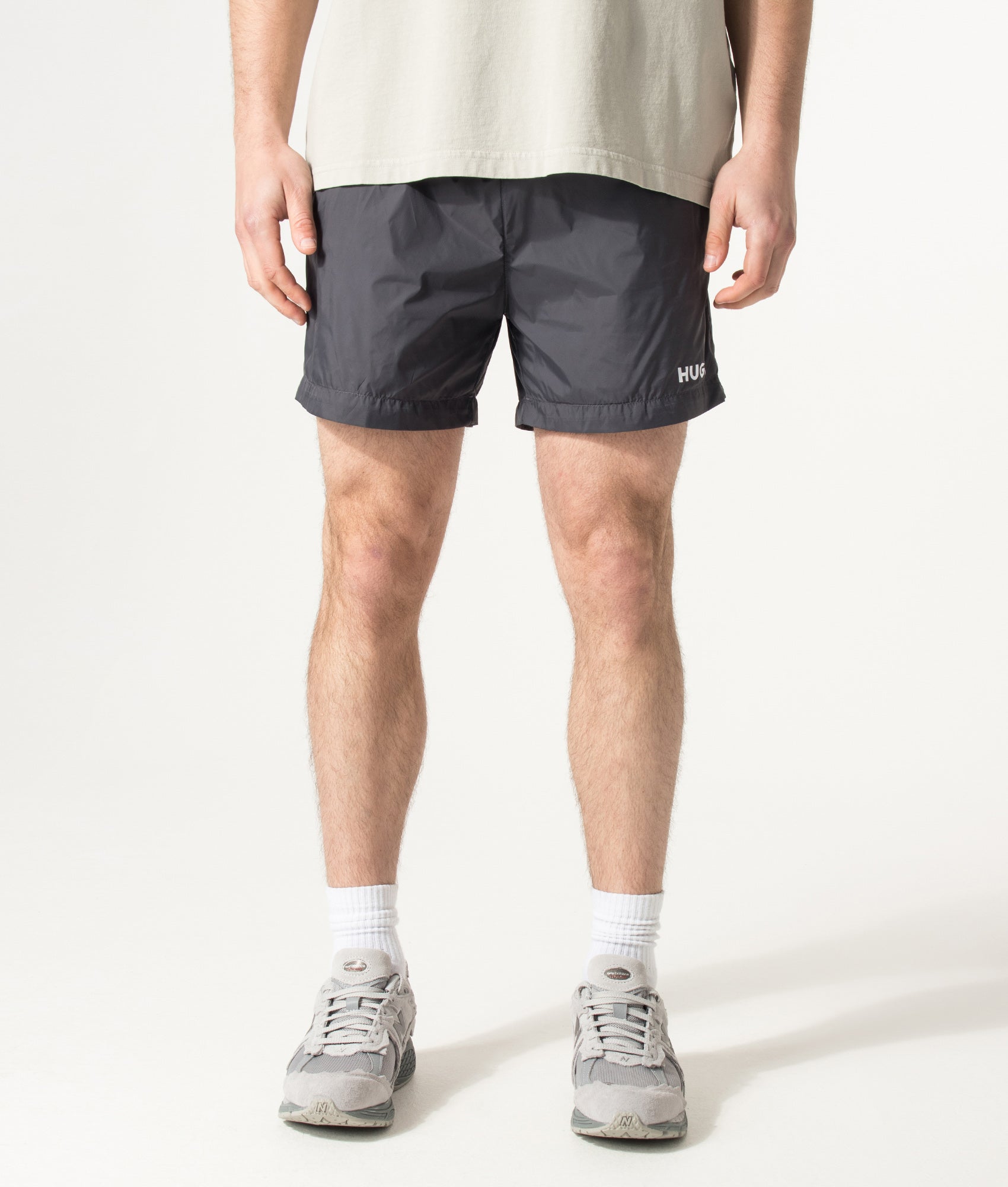 HUGO HAITI Swim Shorts in Charcoal at EQVVS Menswear. Model front shot.