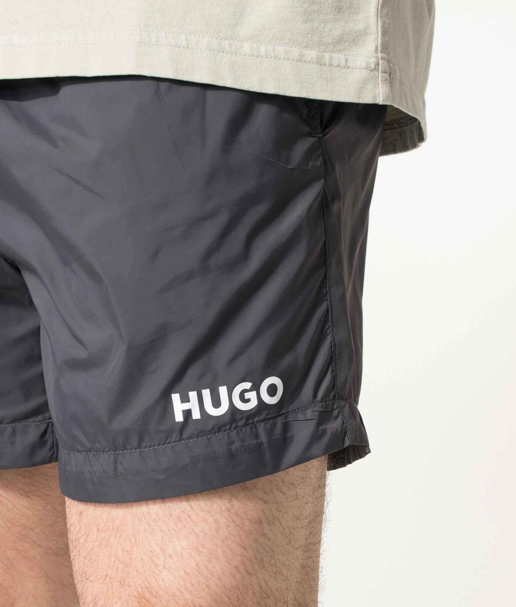 HUGO HAITI Swim Shorts in Charcoal at EQVVS Menswear.  Detail shot.