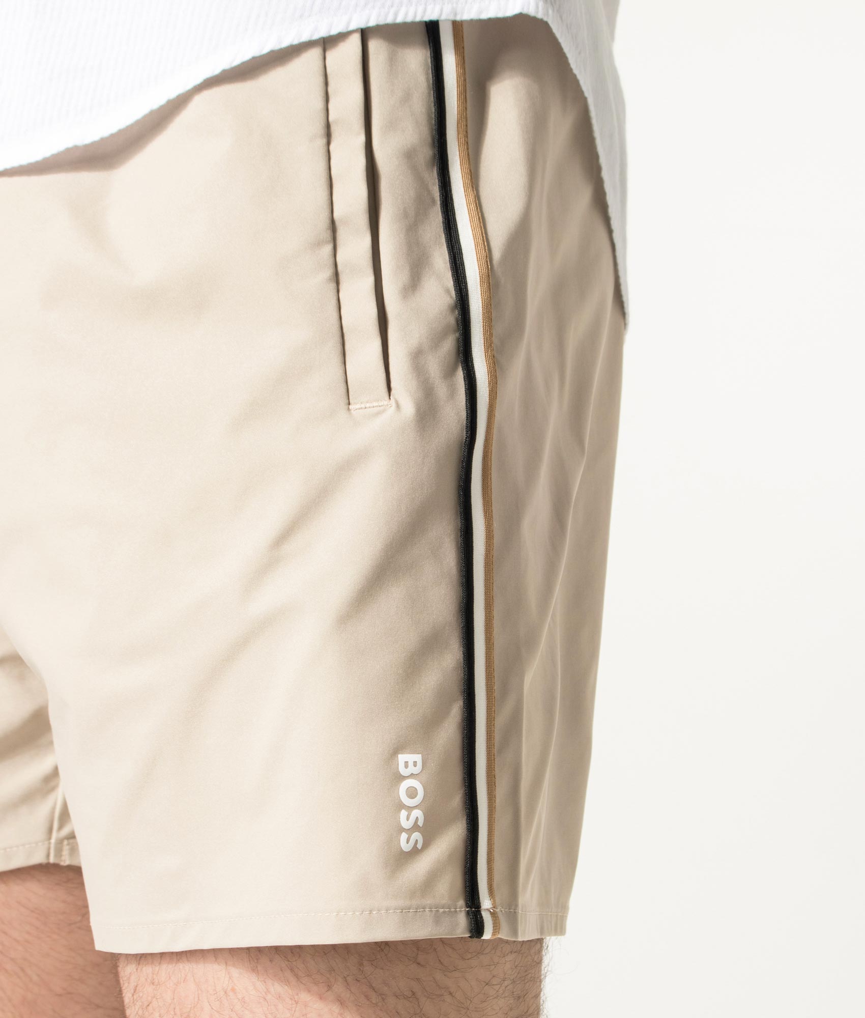 BOSS Iconic Swim Shorts in Light Beige at EQVVS Menswear. Detail shot.