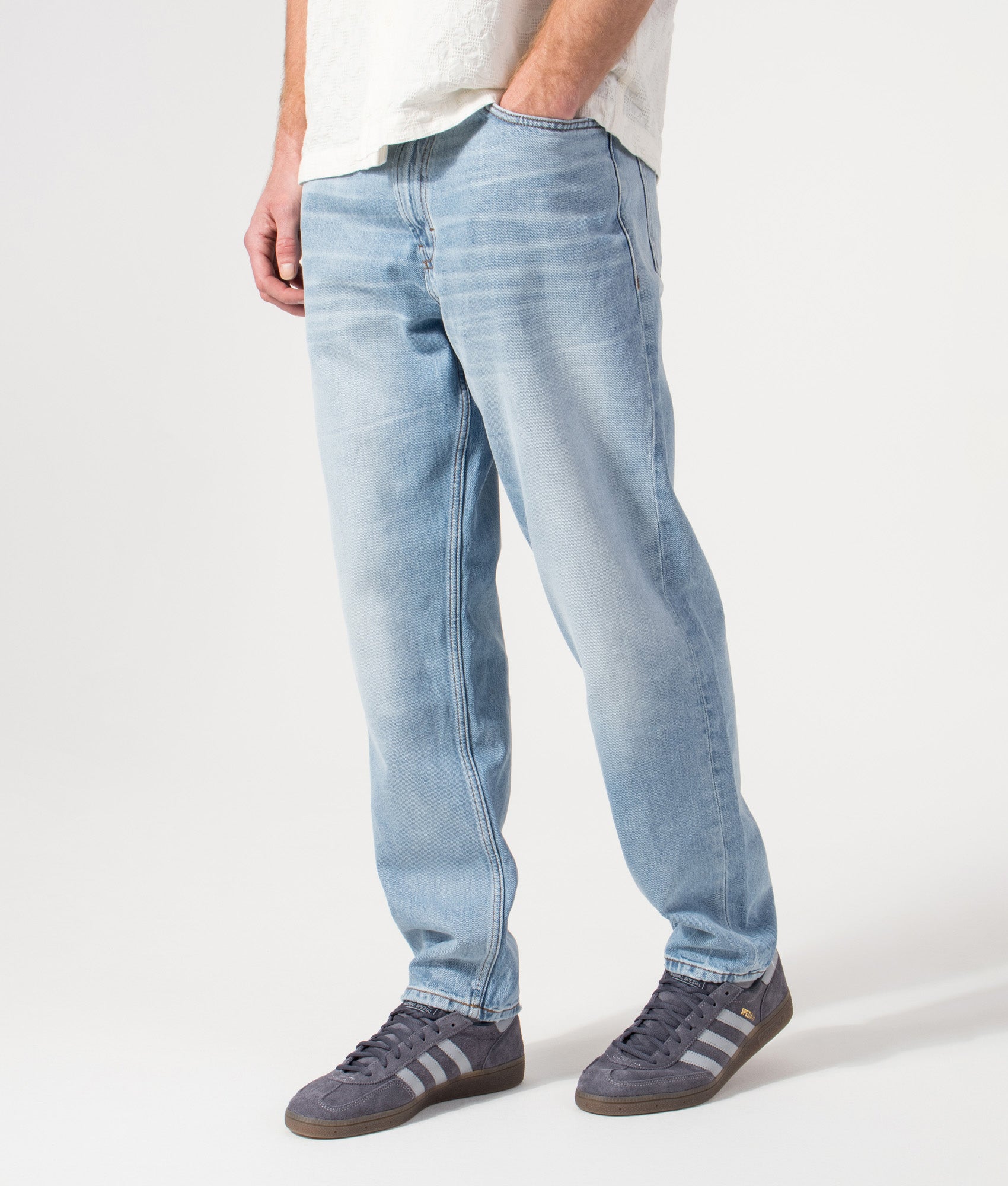 Regular Fit HUGO 838 Jeans in Bright Blue by HUGO. Shot by EQVVS. Front angled shot.