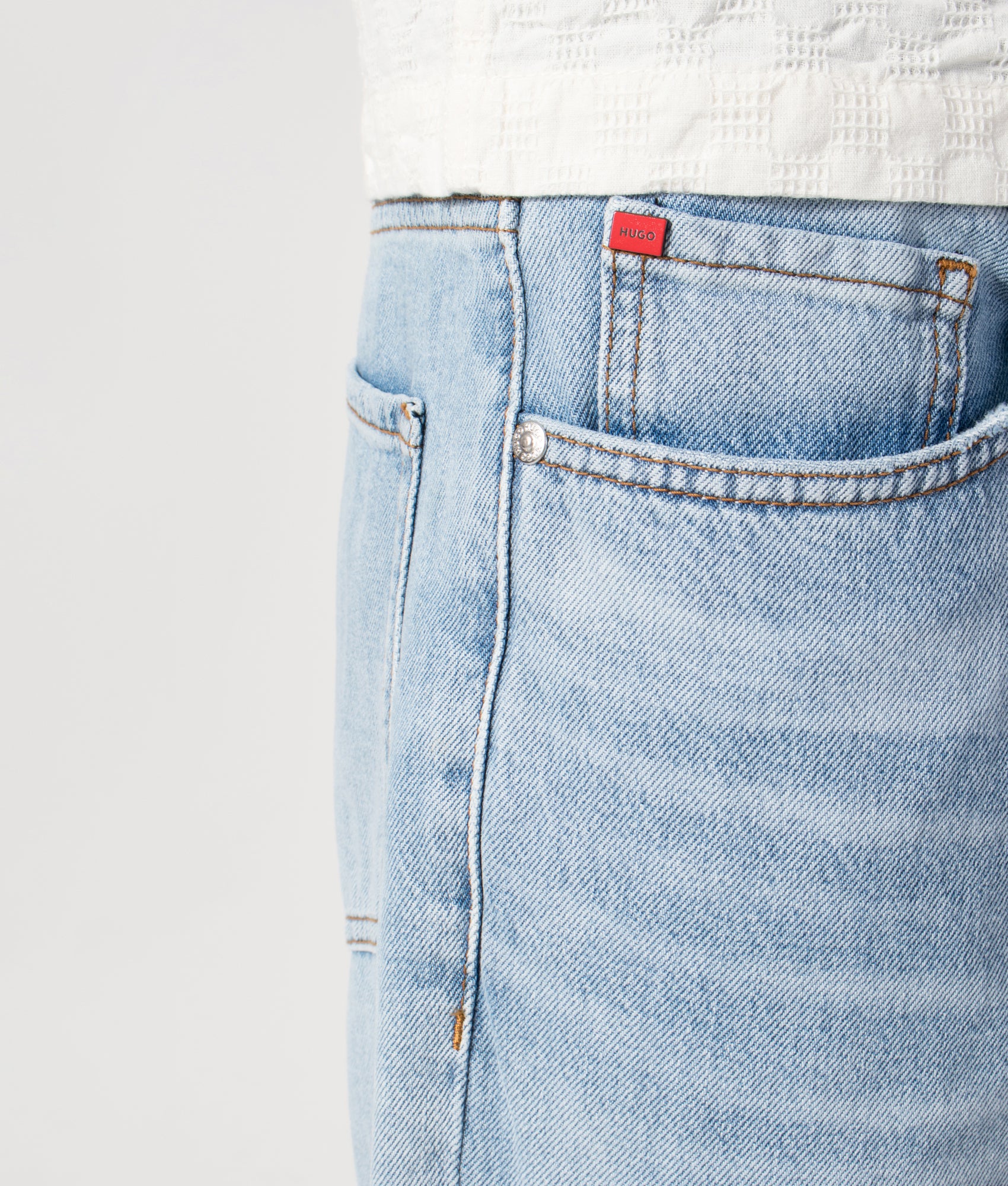 Regular Fit HUGO 838 Jeans in Bright Blue by HUGO. Shot by EQVVS. Front detail shot.