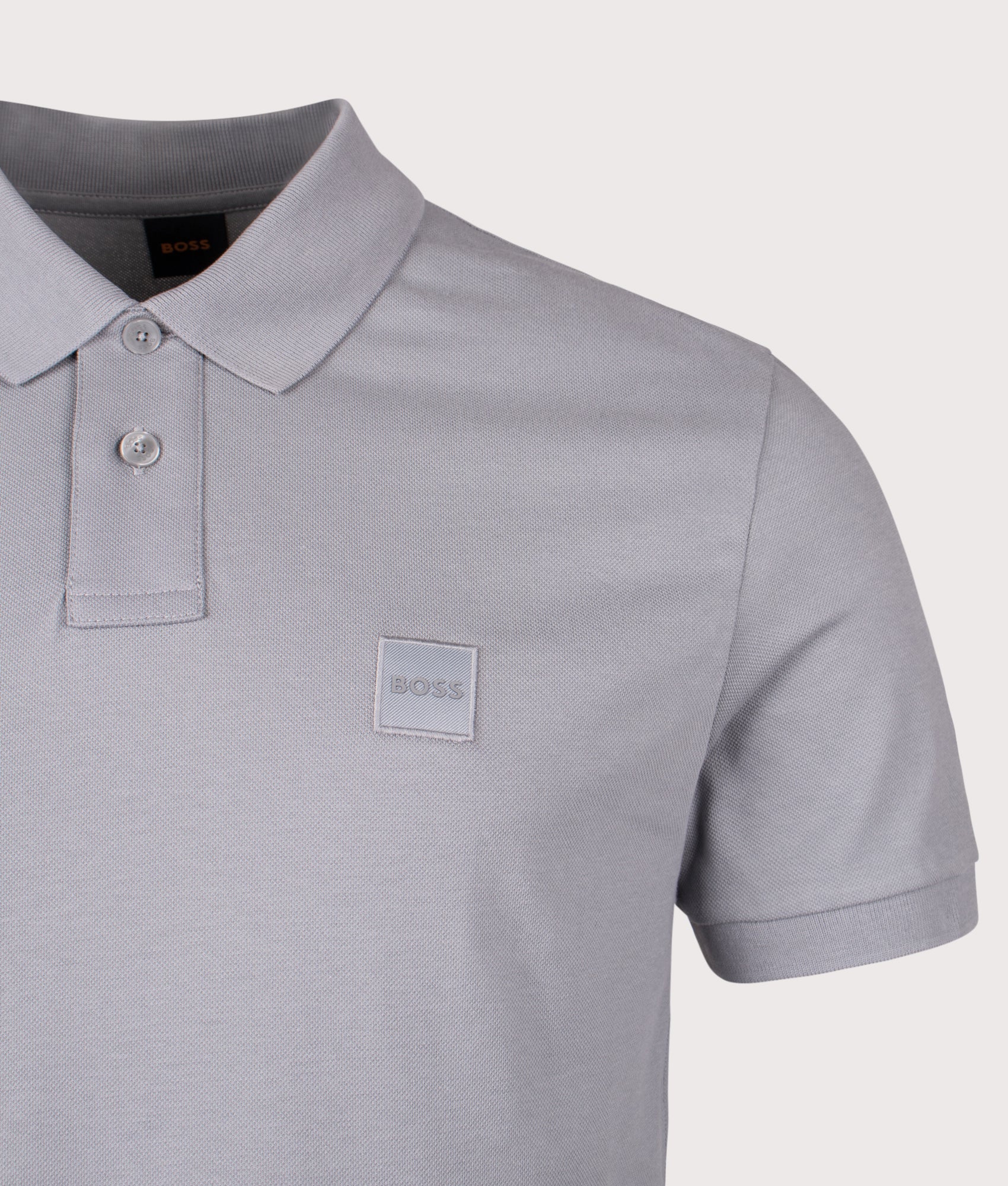 BOSS Slim Fit Passenger Polo Shirt in Silver at EQVVS Menswear. Detail shot.
