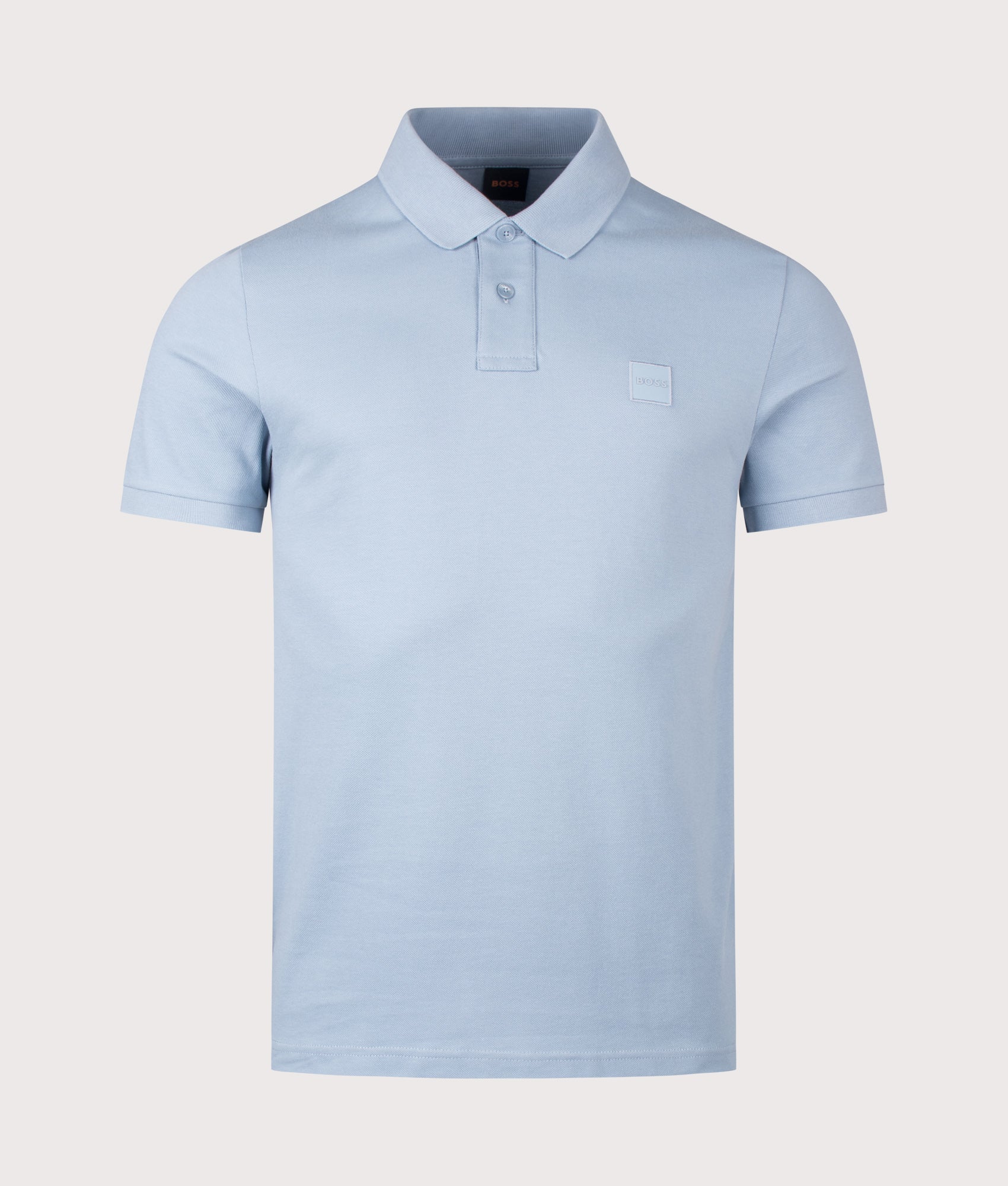 Slim Fit Passenger Polo Shirt in Light/Pastel Blue by BOSS. Shot by EQVVS. Front shot.
