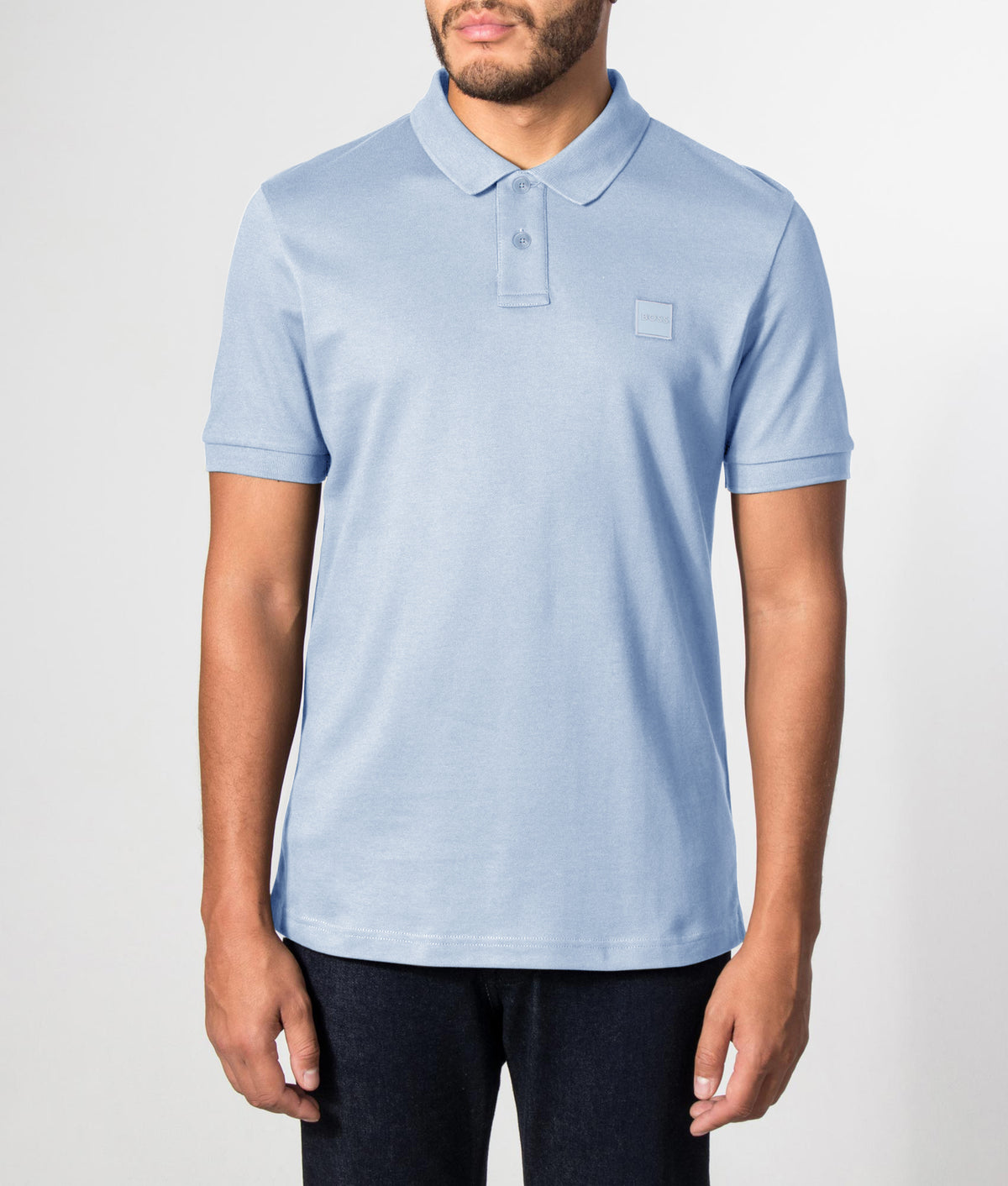 Slim Fit Passenger Polo Shirt in Light/Pastel Blue by BOSS. Shot by EQVVS. Front model shot.