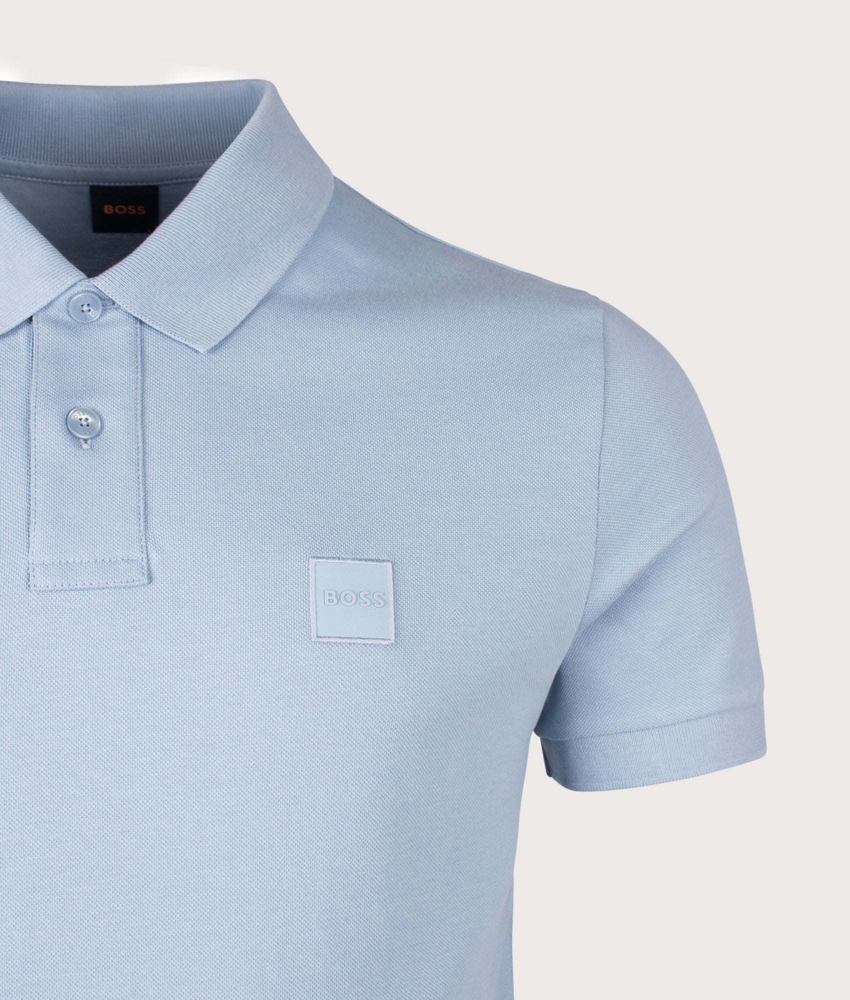 Slim Fit Passenger Polo Shirt in Light/Pastel Blue by BOSS. Shot by EQVVS. Detail shot.