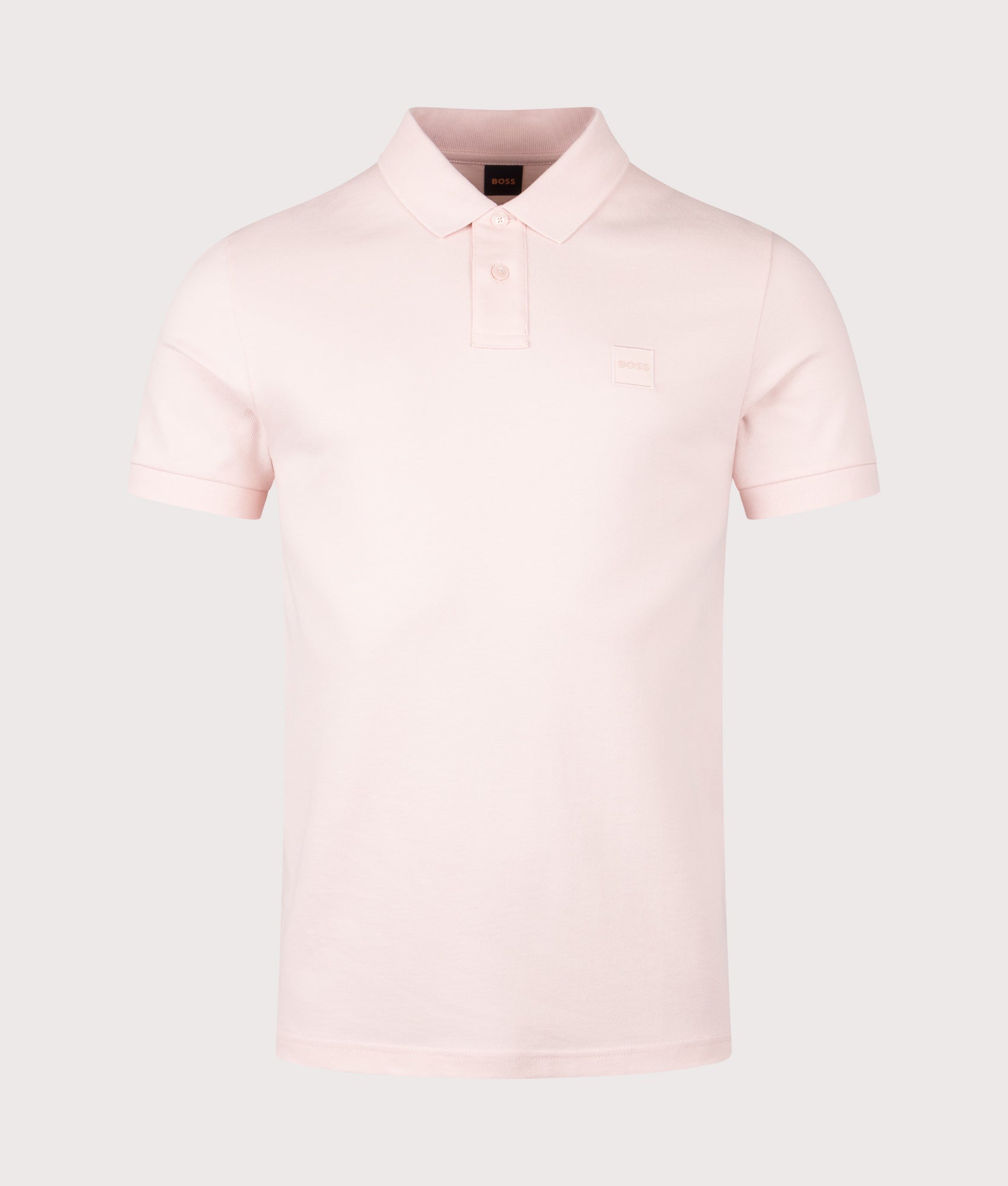 BOSS Slim Fit Passenger Polo Shirt in Open Pink at EQVVS Menswear. Front shot.