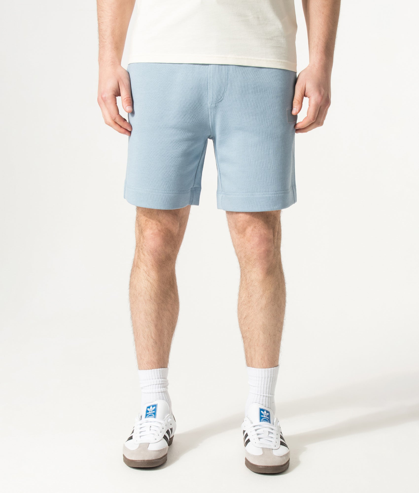 BOSS Sewalk Sweat Shorts in Light/Pastel Blue at EQVVS Menswear. Model front shot.