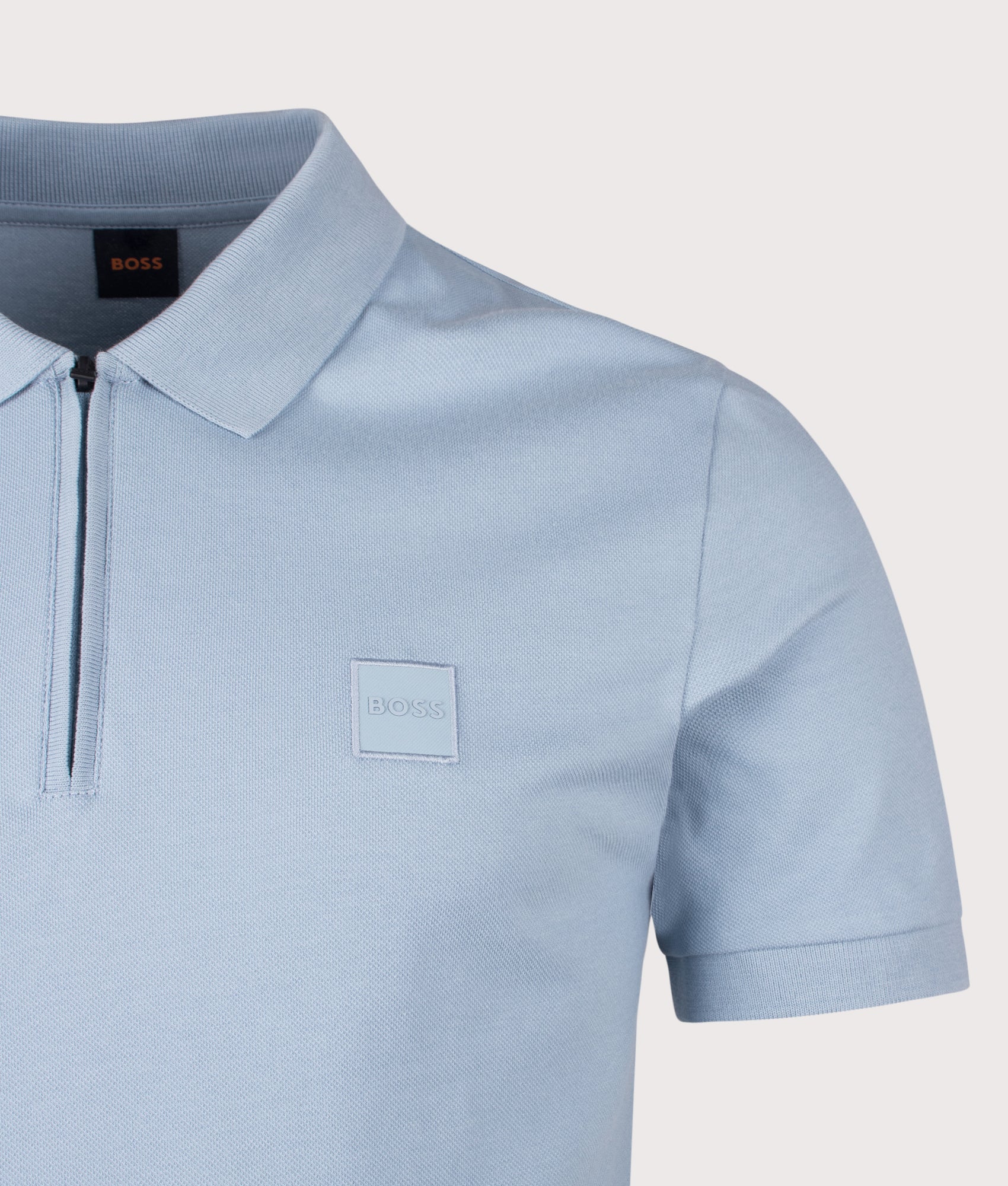 Slim Fit Passerzip Polo Shirt in Light/Pastel Blue by BOSS. Shot by EQVVS. Detail shot.