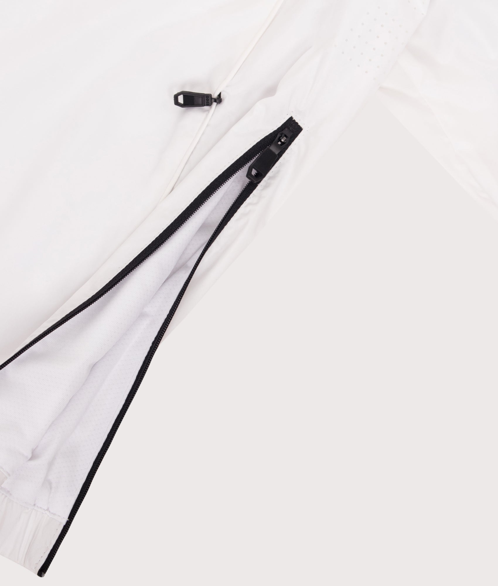 Quarter Zip Serve Windcheater in White by BOSS. Shot by EQVVS. Detail side shot.