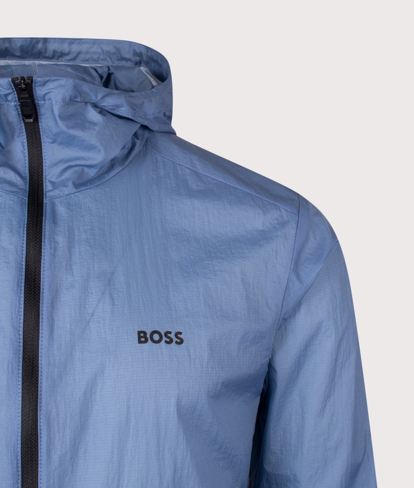 Airynix Hooded Jacket in Light/Pastel Blue by BOSS. Shot by EQVVS. Detail shot.