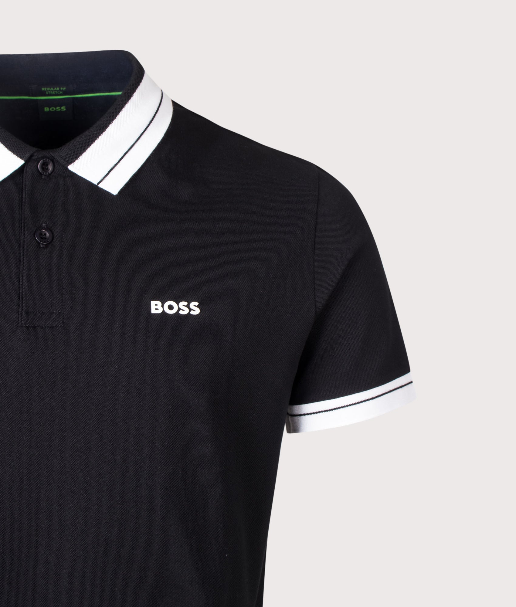 BOSS Regular Fit Member Polo Shirt in Black at EQVVS Menswear. Detail shot.