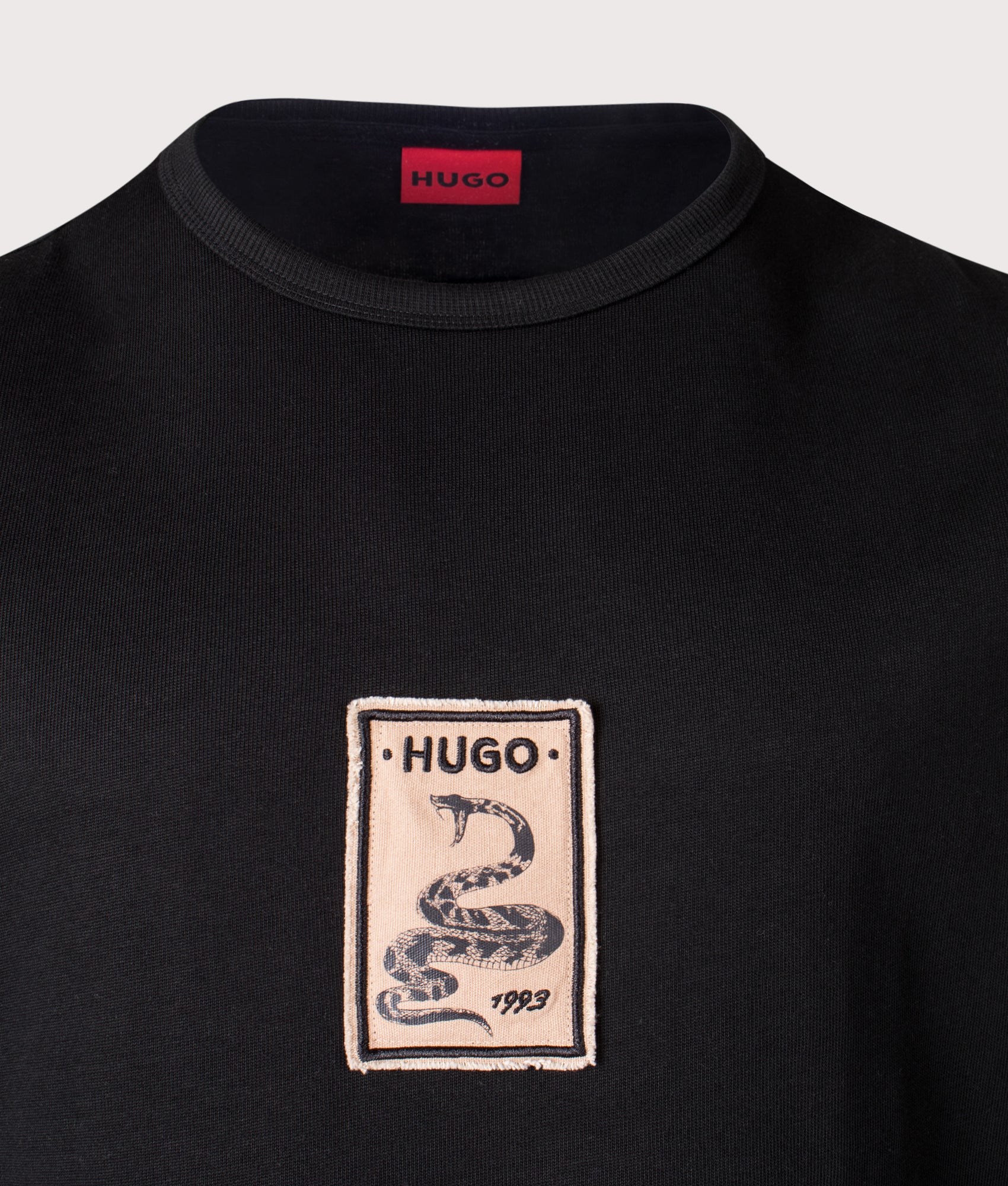 HUGO Oversized Draxon T-Shirt in Black at EQVVS Menswear. Detail shot.