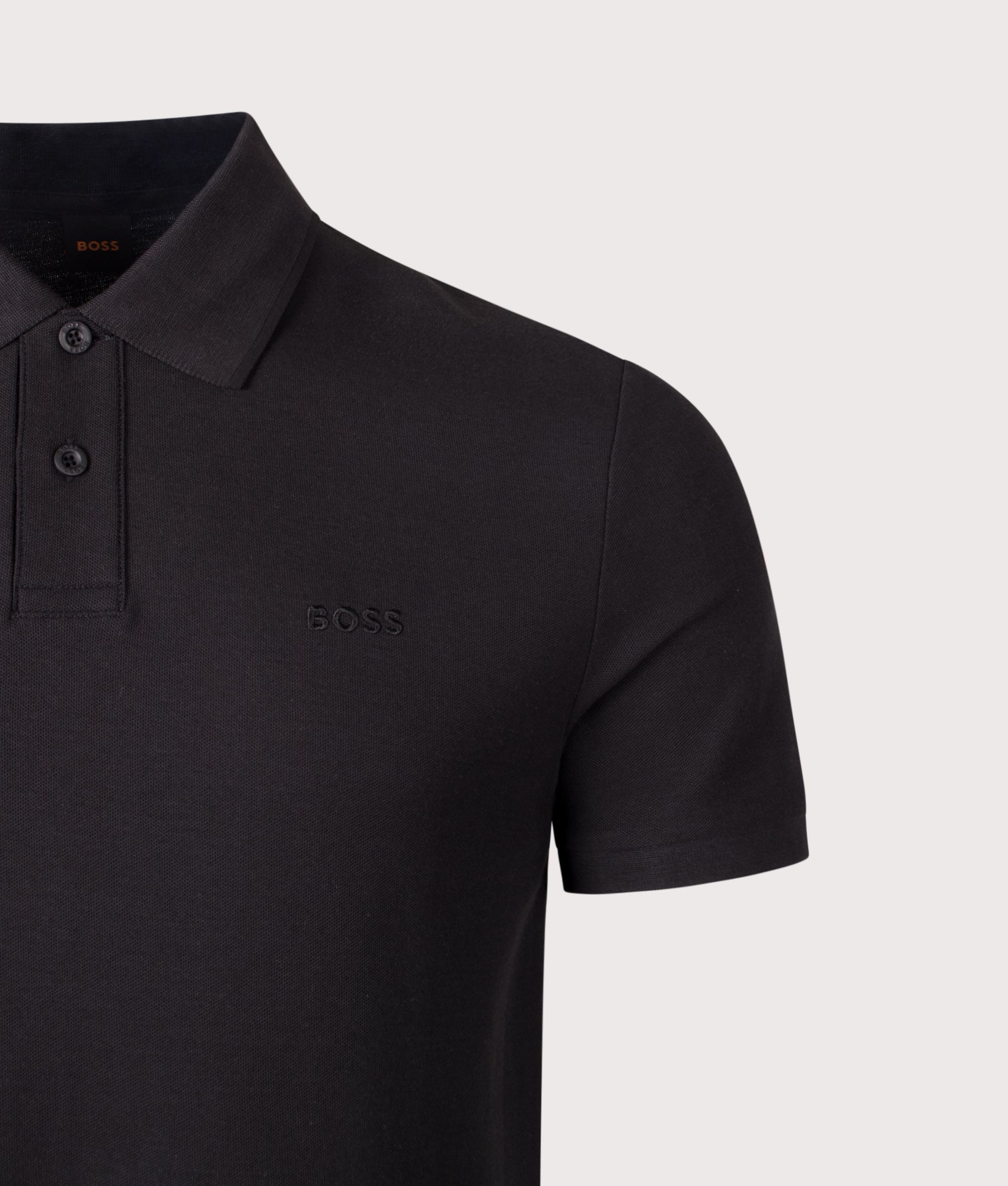 BOSS Phoenix Honeycomb Polo Shirt in Black at EQVVS Menswear. Detail shot.