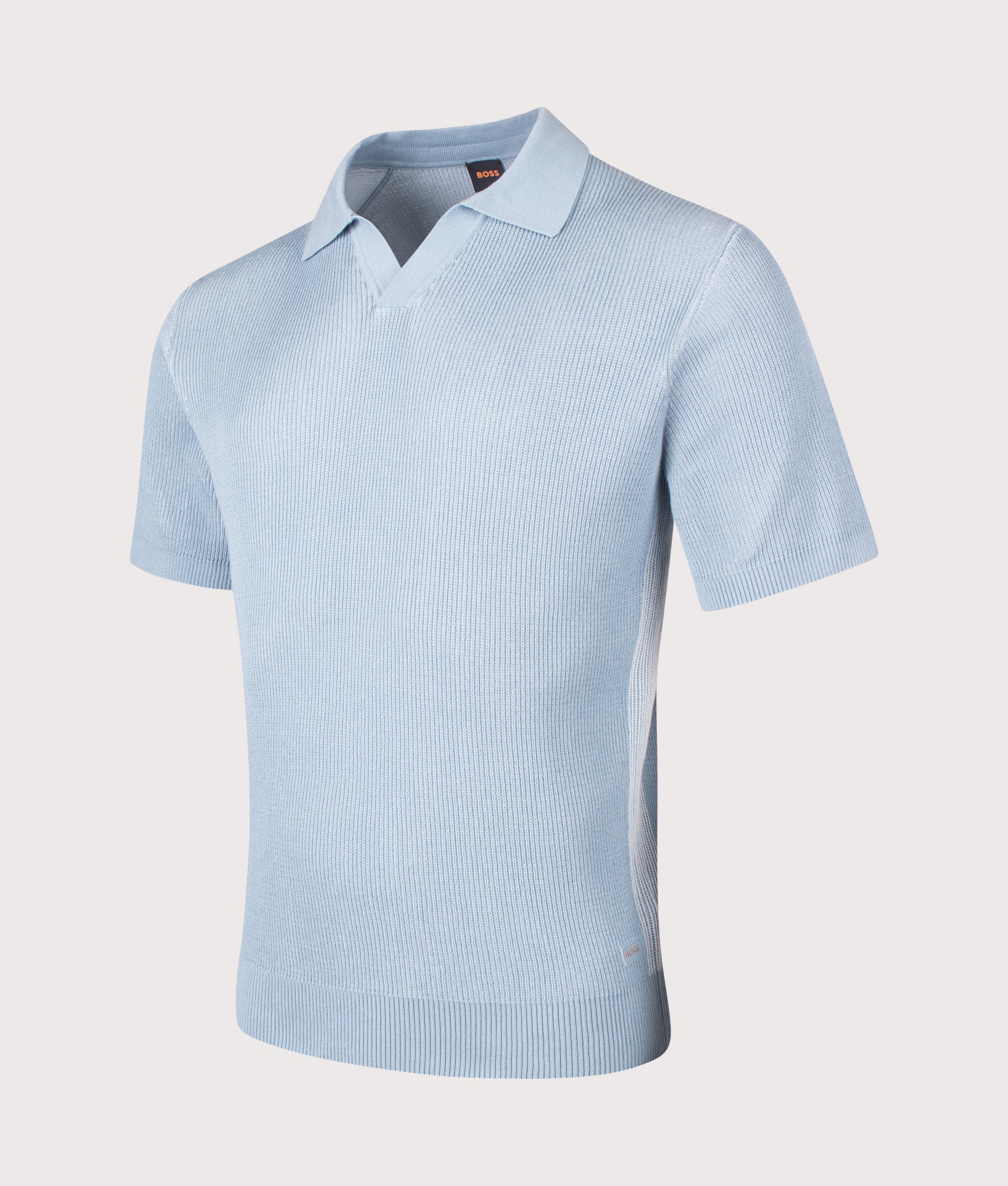 Aravolo Knit Polo Shirt in Light/Pastel Blue by BOSS. Shot by EQVVS. Front  angled shot.