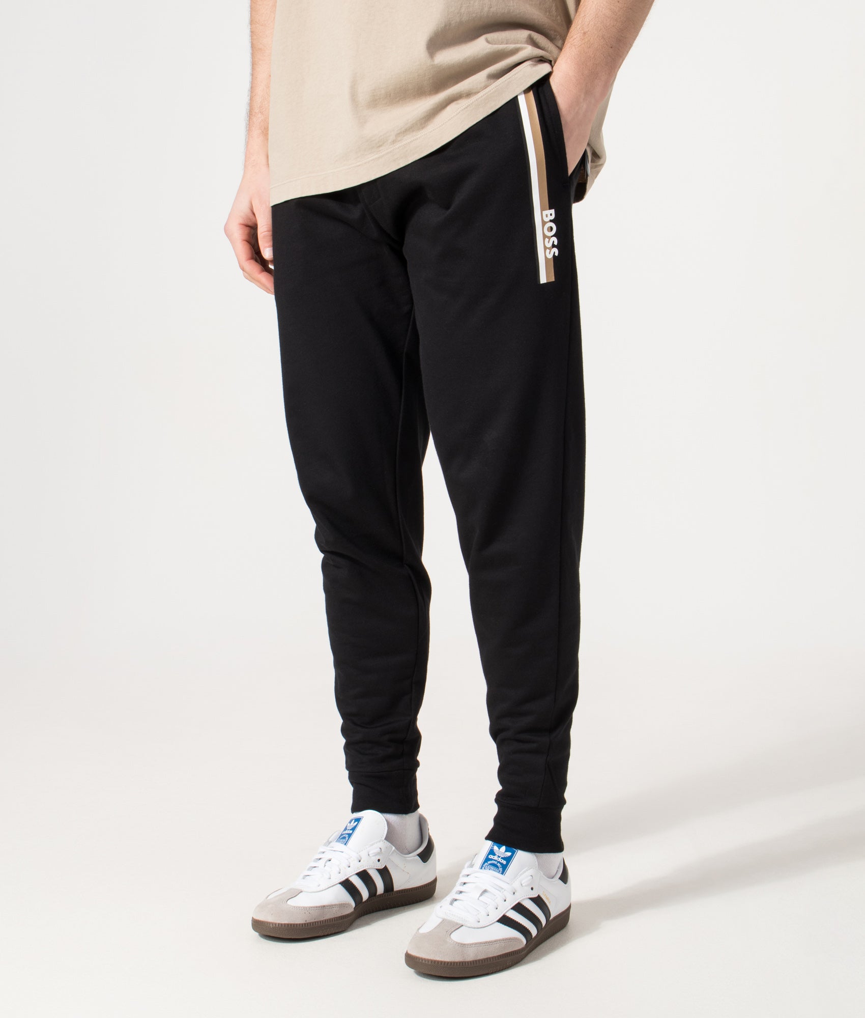 BOSS Authentic Track pants in Black at EQVVS Menswear. Angled model front shot.