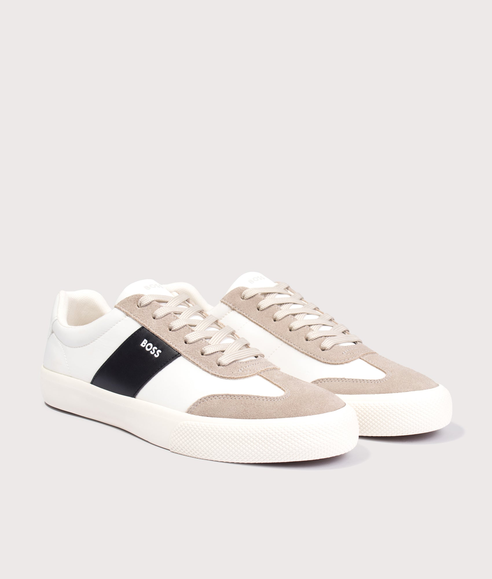 BOSS Aiden Tenn Trainers in Light Beige at EQVVS Menswear. Angled front shot.