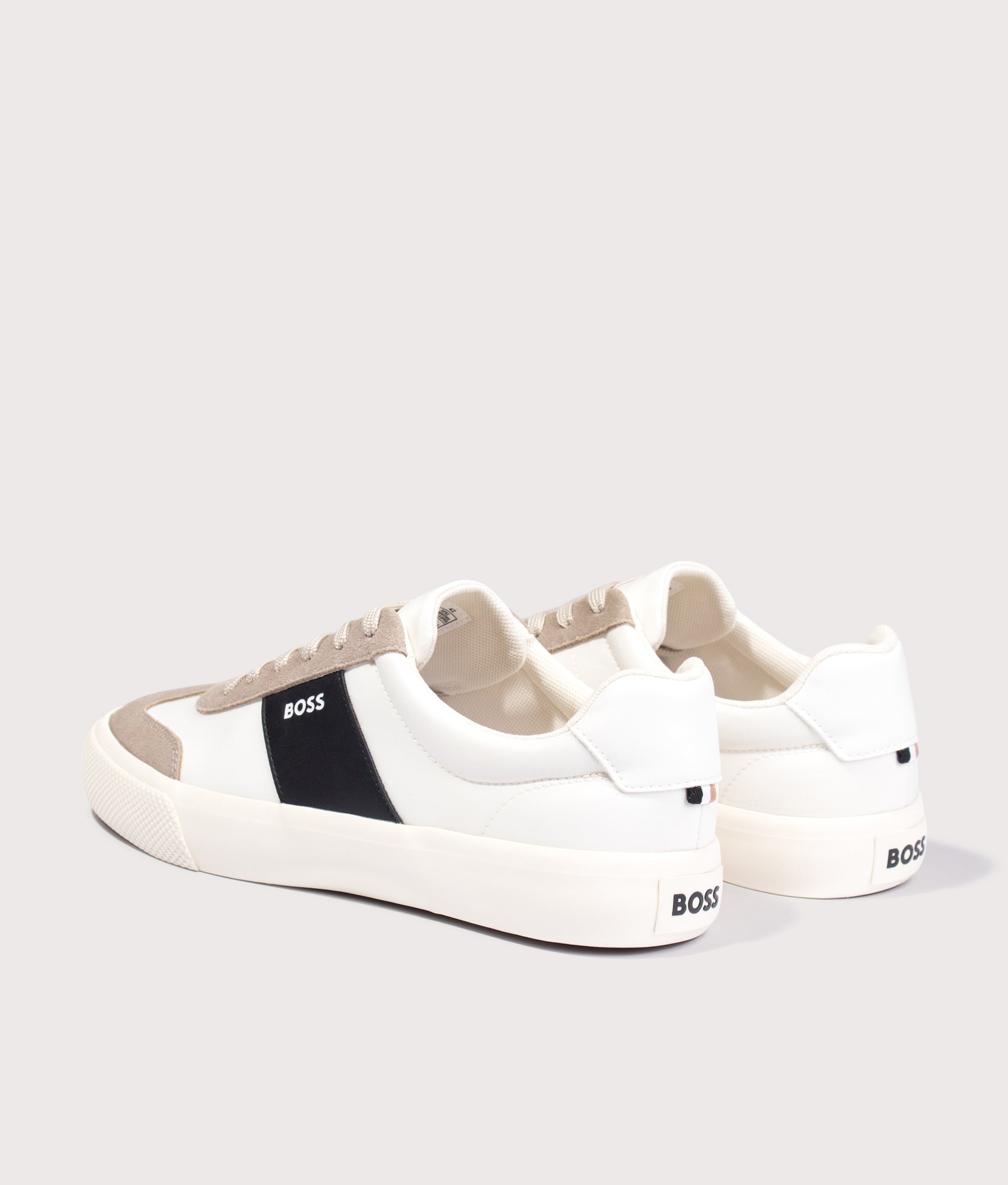 BOSS Aiden Tenn Trainers in Light Beige at EQVVS Menswear. Angled back shot.