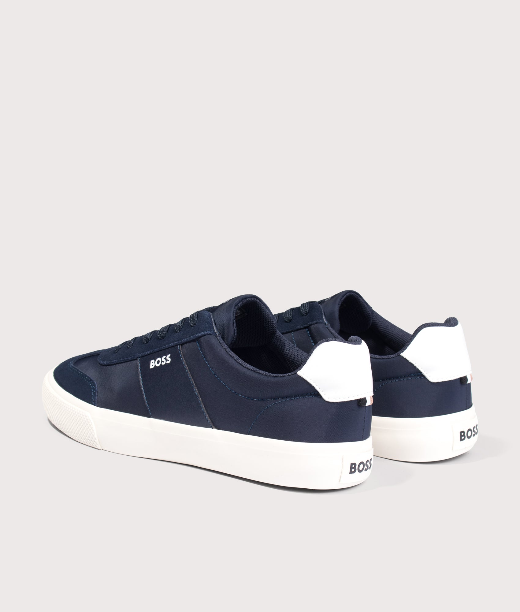 BOSS Aiden Tenn Trainers in Dark Blue at EQVVS Menswear. Angled back shot.