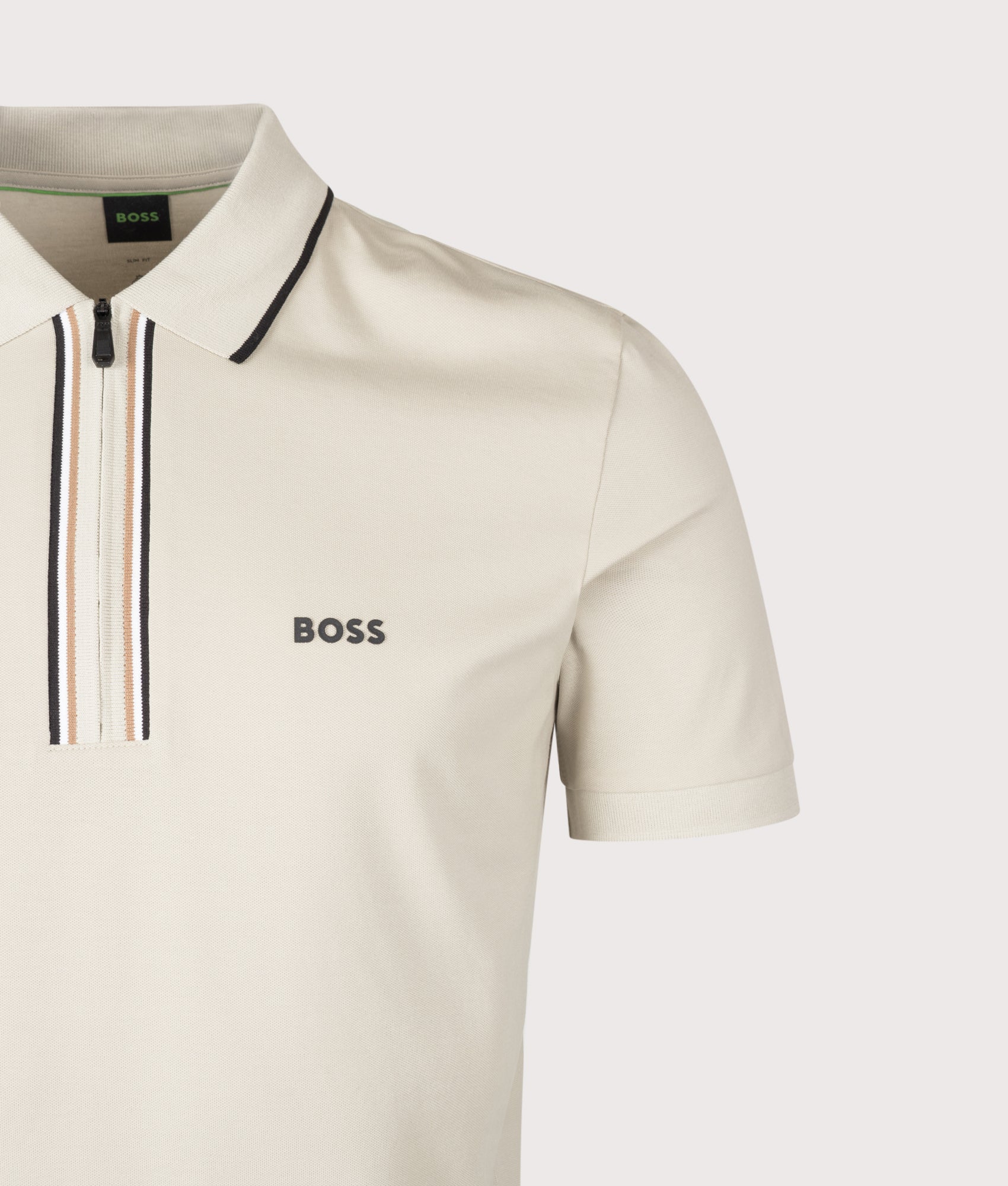 BOSS Slim Fit Philix Polo Shirt in Light Beige at EQVVS Menswear. Detail shot.