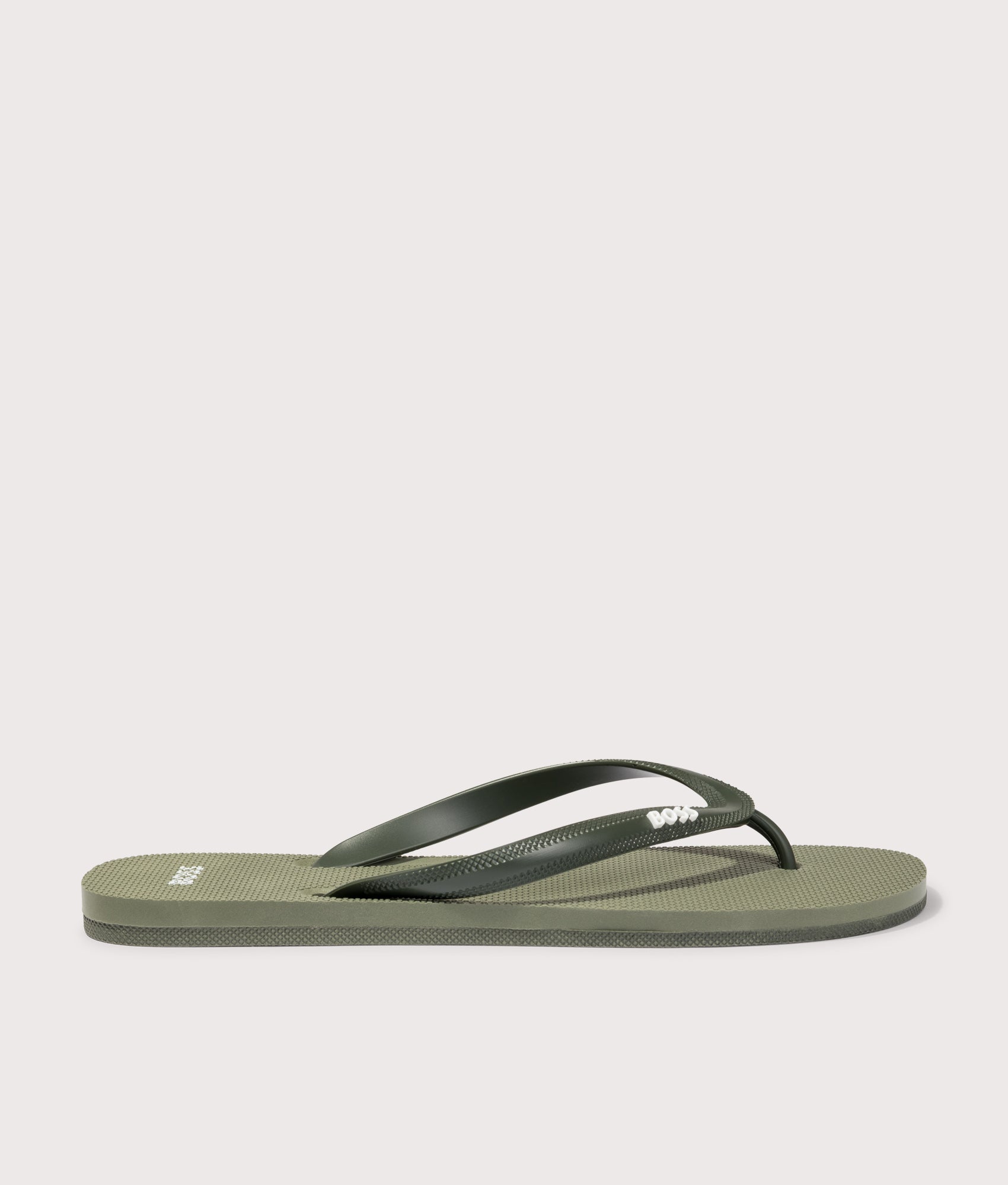 BOSS Tracy Branded Strap Flip Flops in Open Green at EQVVS Menswear. Side shot.