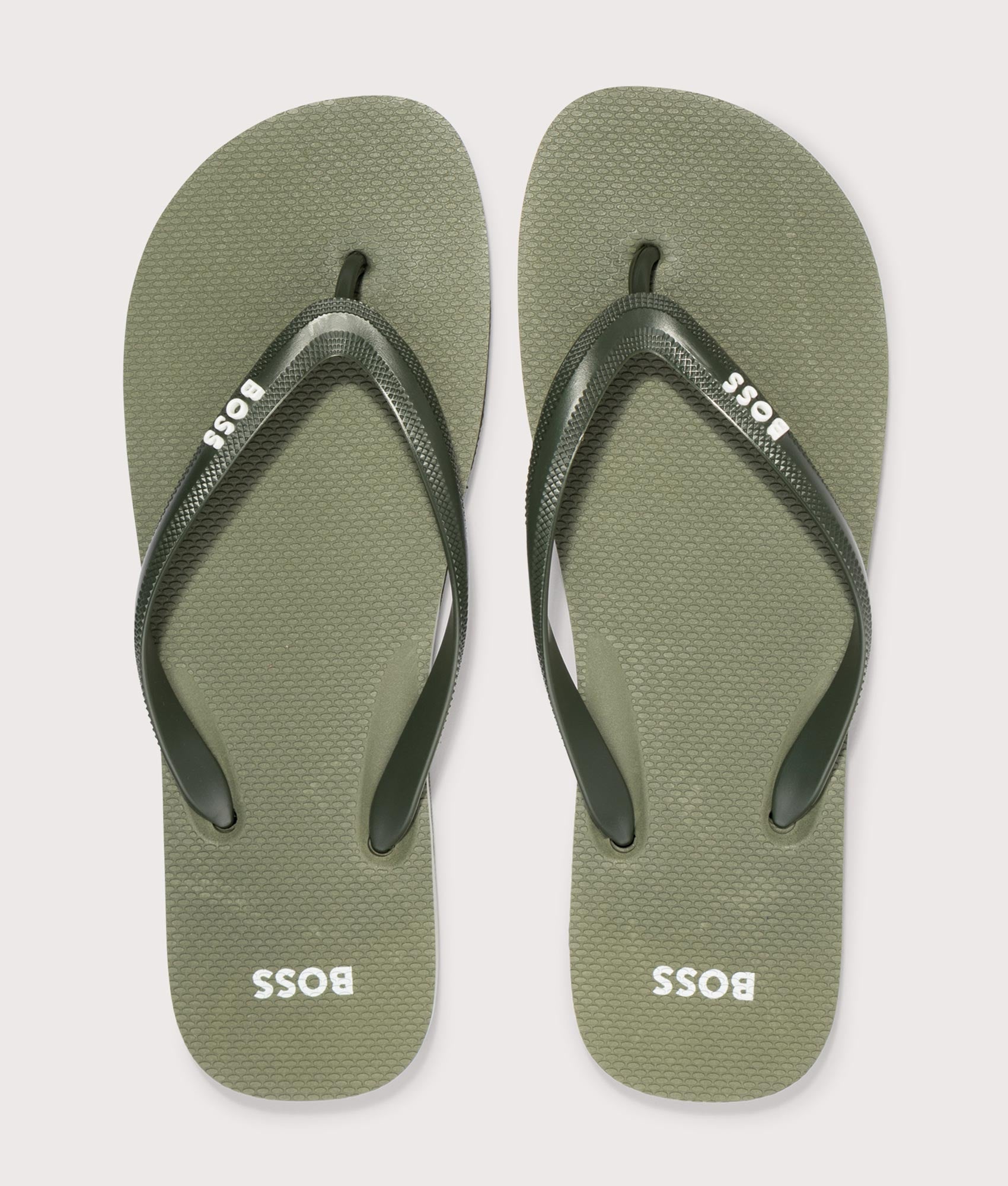 BOSS Tracy Branded Strap Flip Flops in Open Green at EQVVS Menswear. Top shot.