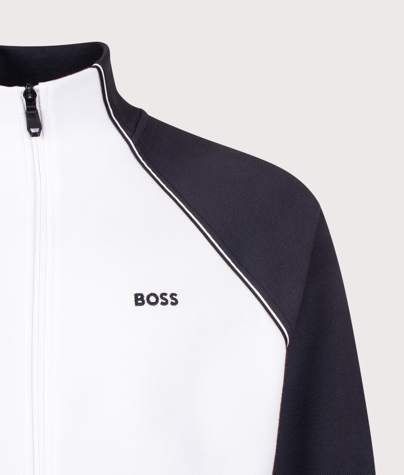 Join Skaz Track Top in White by BOSS. Shot by EQVVS. Detail shot.