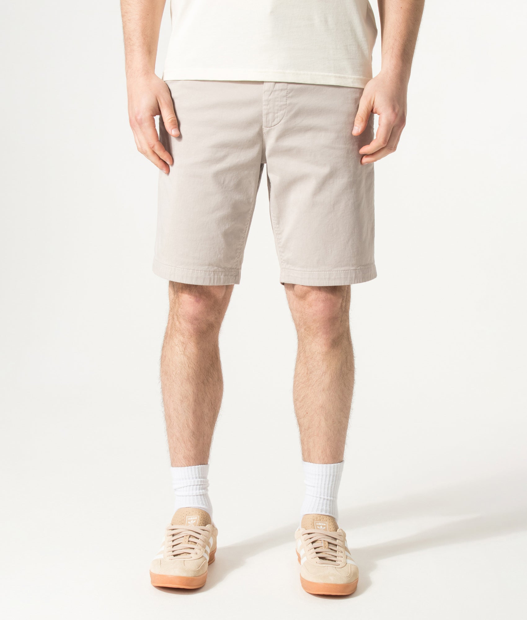 BOSS Slim Fit Chino Shorts in Open Grey at EQVVS Menswear. Model front shot.