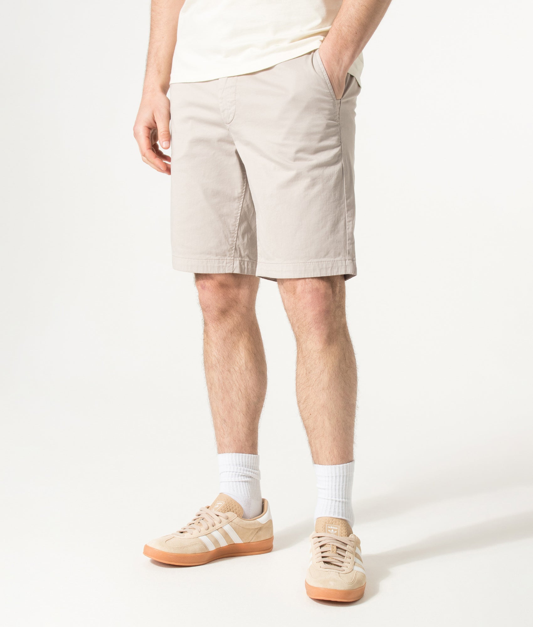 BOSS Slim Fit Chino Shorts in Open Grey at EQVVS Menswear. Angled model front shot.