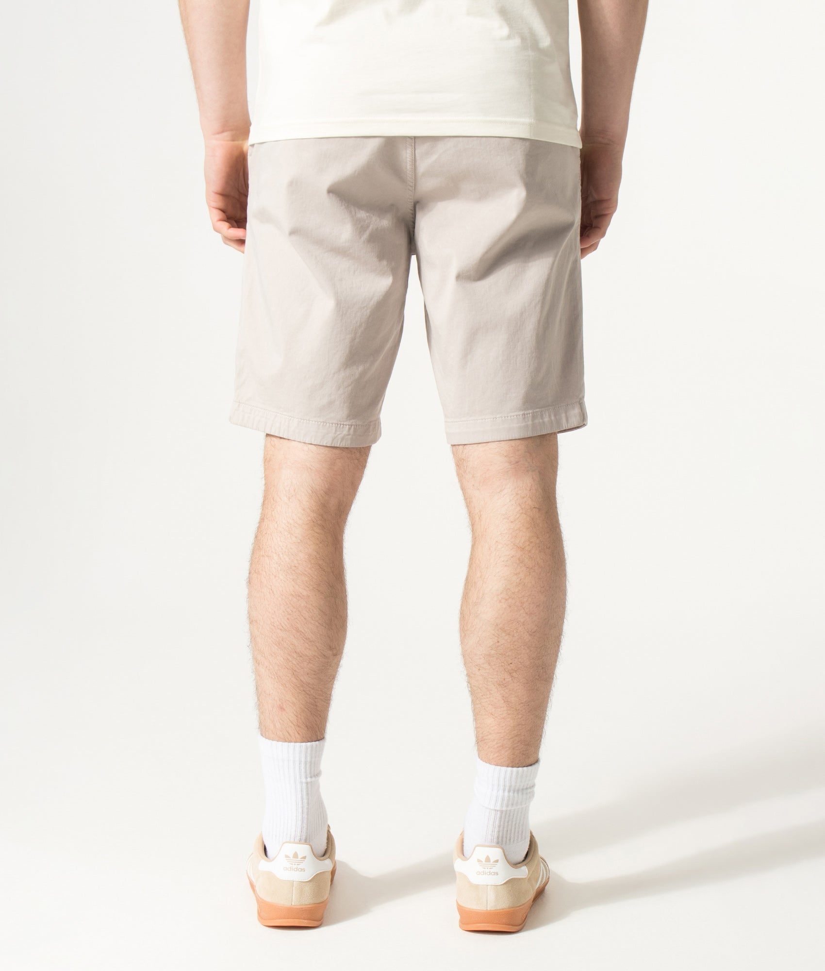BOSS Slim Fit Chino Shorts in Open Grey at EQVVS Menswear. Model back shot.