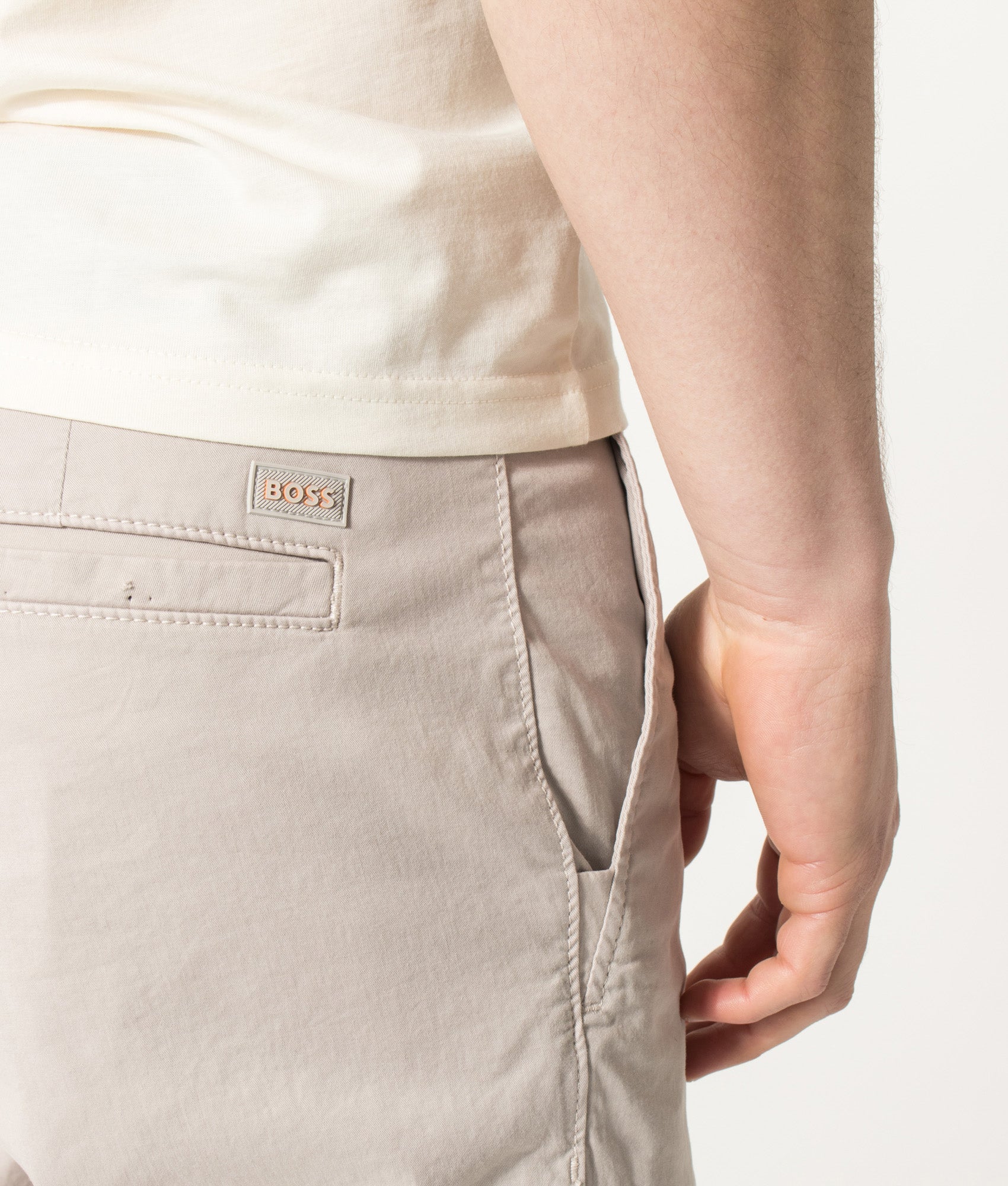 BOSS Slim Fit Chino Shorts in Open Grey at EQVVS Menswear. Detail shot.
