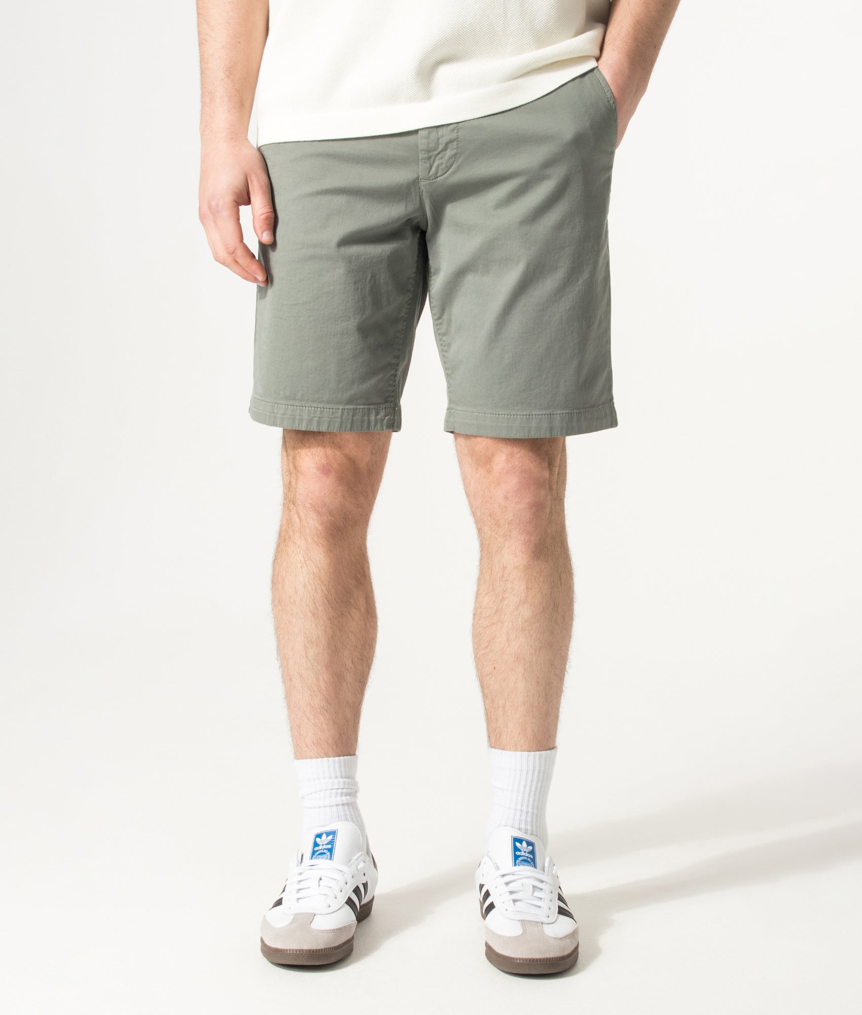 BOSS Slim Fit Chino Shorts in Open Grey at EQVVS Menswear. Model front shot.