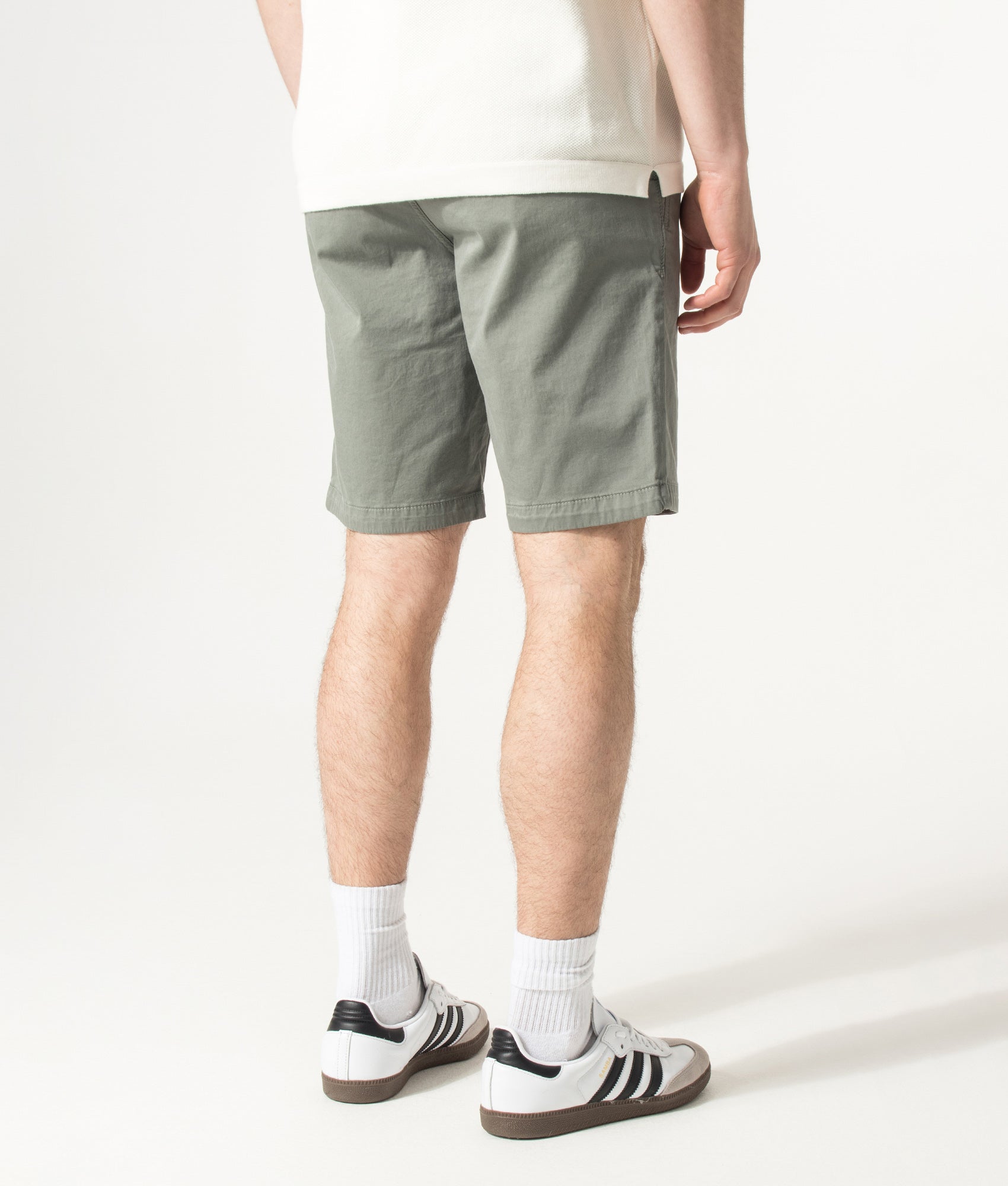 BOSS Slim Fit Chino Shorts in Open Grey at EQVVS Menswear. Angled model back shot.