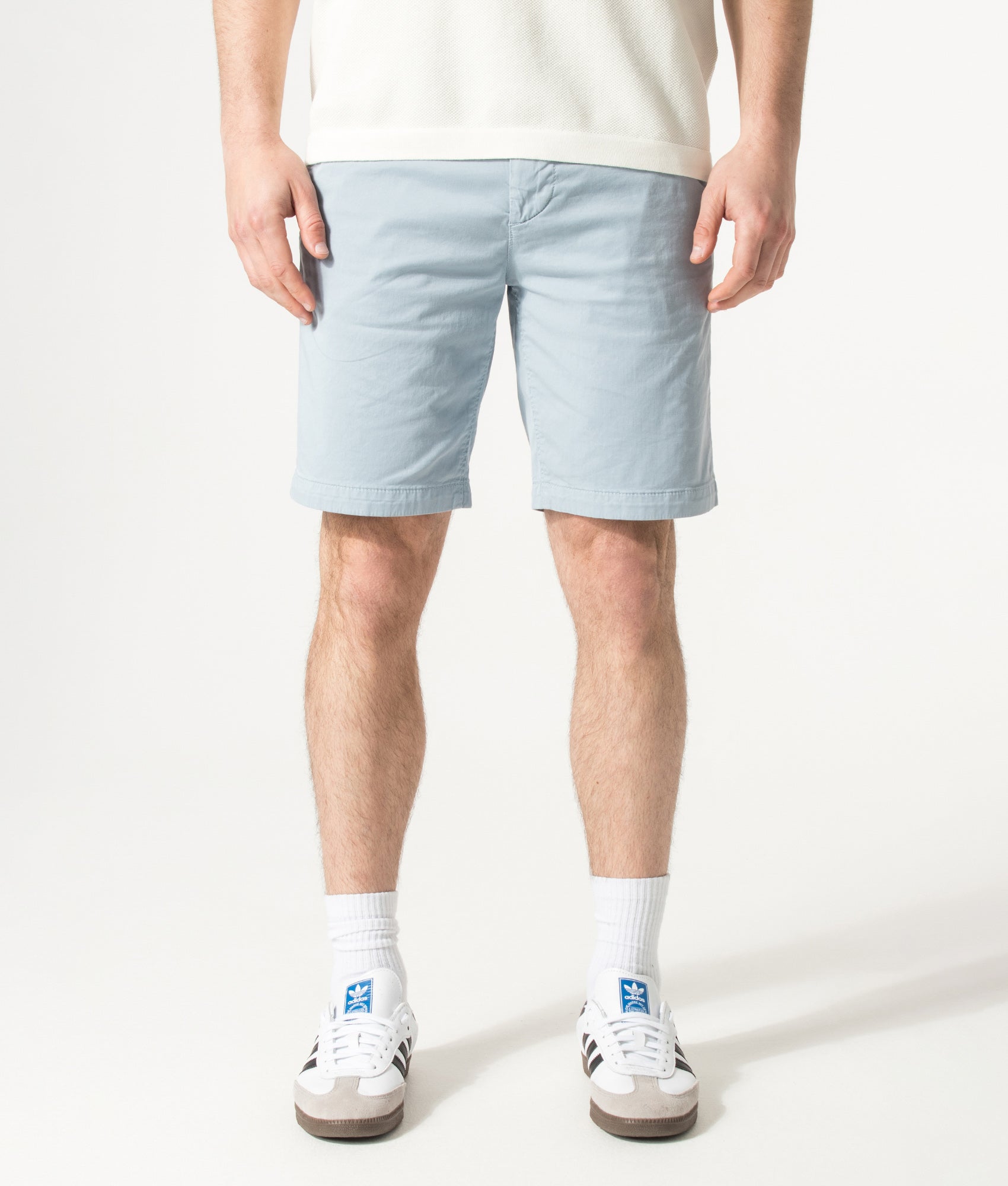BOSS Slim Fit Chino Shorts in Light/Pastel Blue at EQVVS Menswear.  Model front shot.