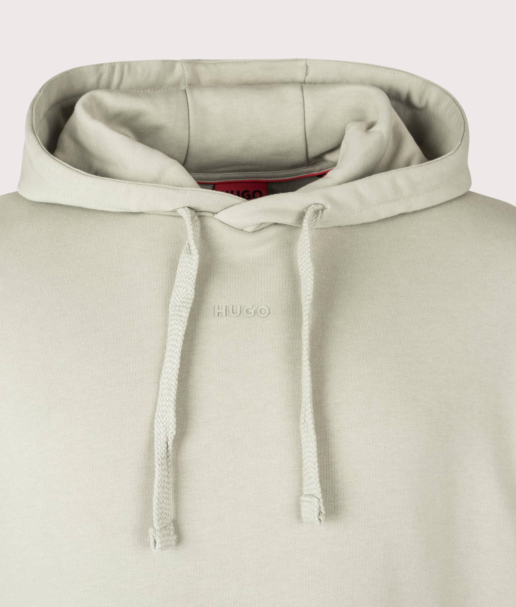 Relaxed Fit Dapo Hoodie in Light/Pastel Green by HUGO. Shot by EQVVS. Detail Shot.