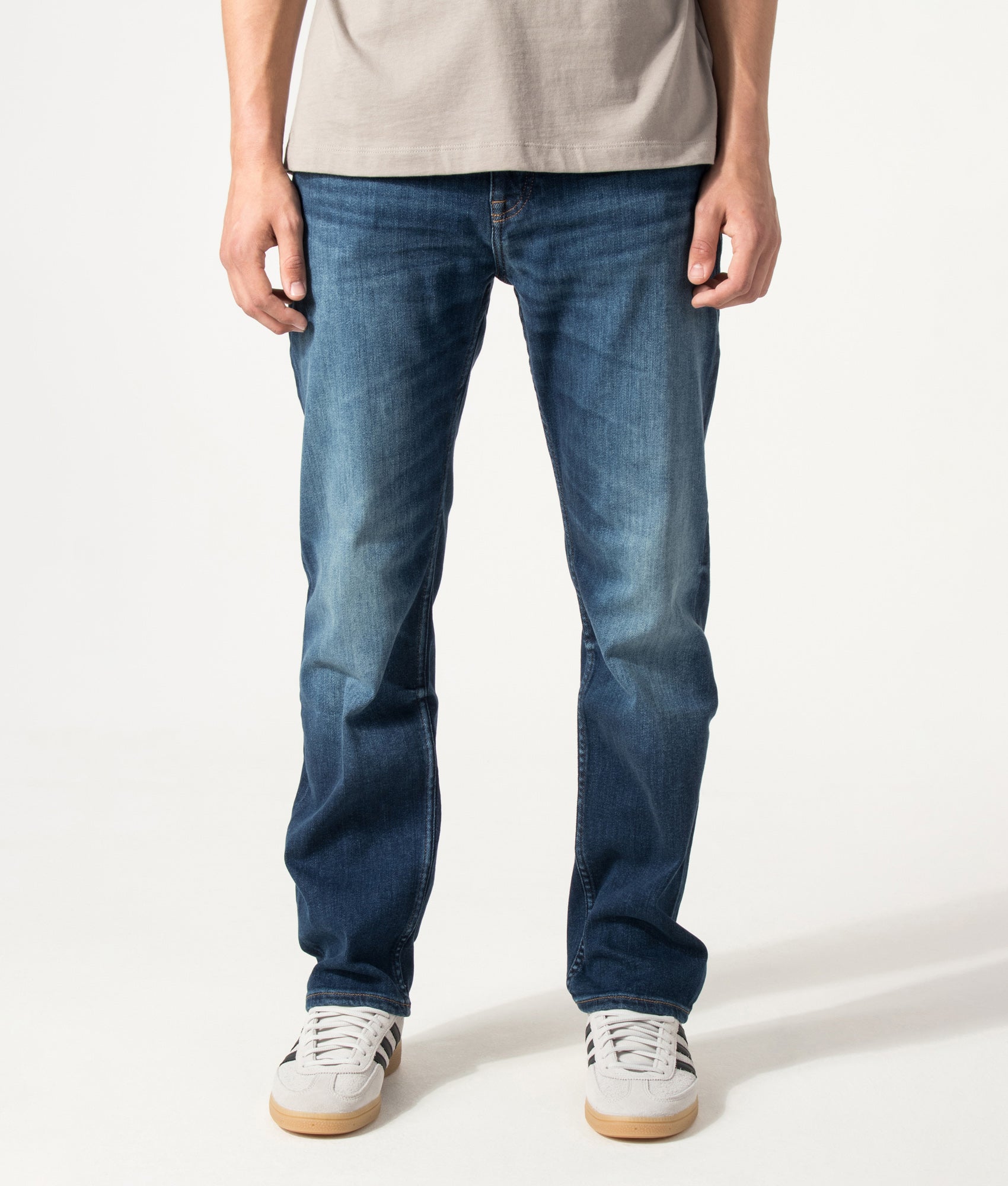 BOSS Ogden Straight Leg Jeans in Navy at EQVVS Menswear. Front shot.
