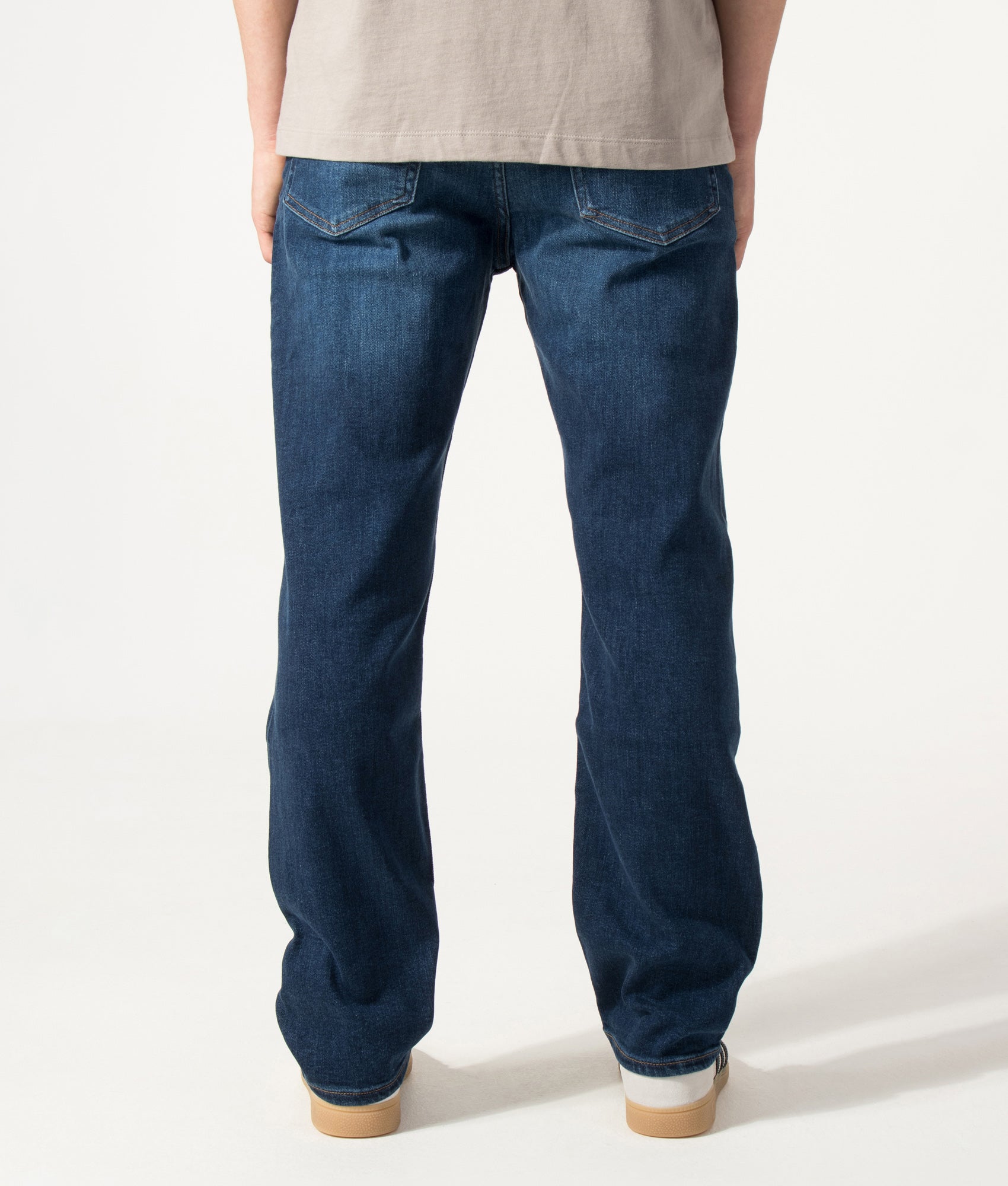 BOSS Ogden Straight Leg Jeans in Navy at EQVVS Menswear. Model back shot.