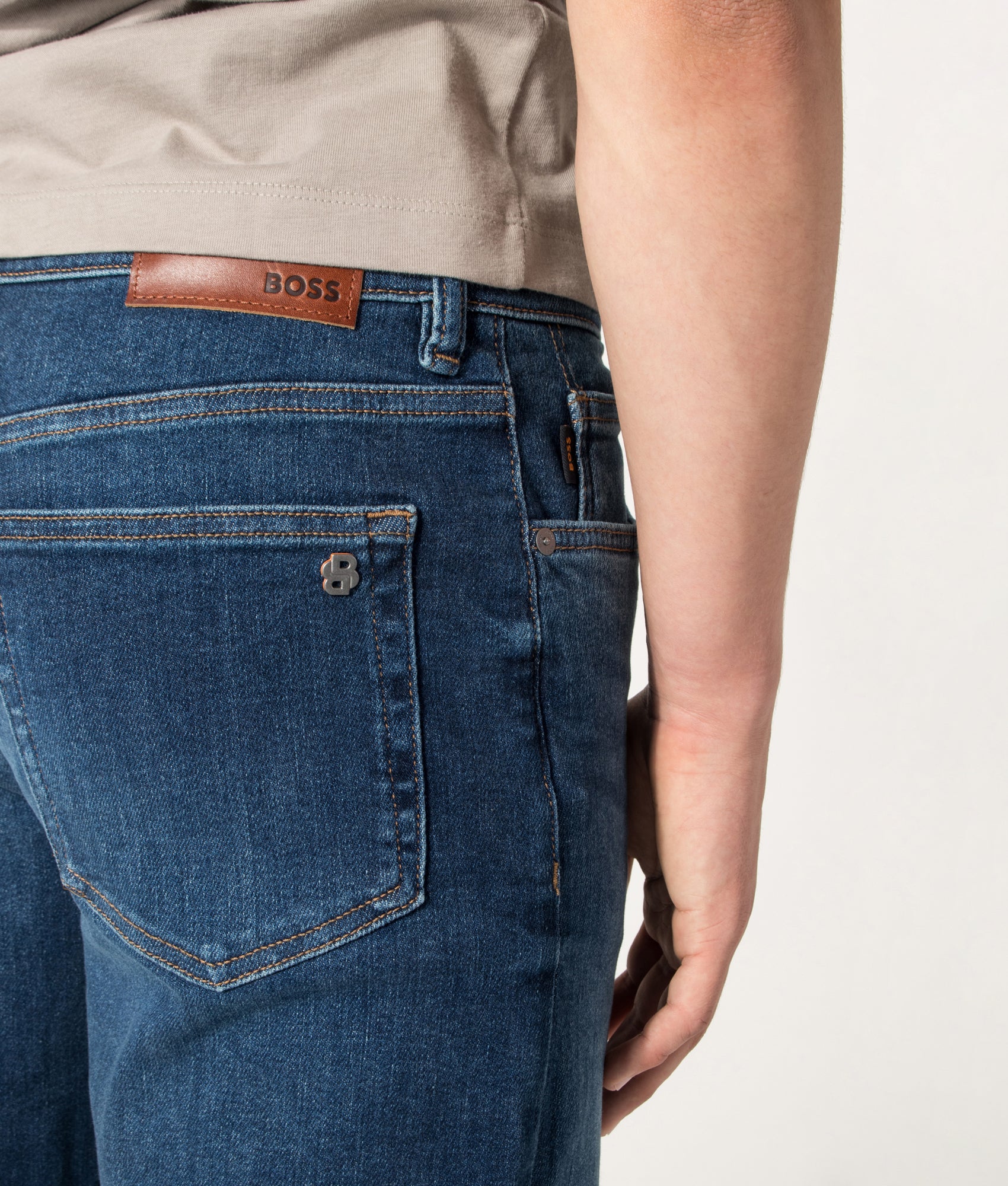 BOSS Ogden Straight Leg Jeans in Navy at EQVVS Menswear. Detail shot.