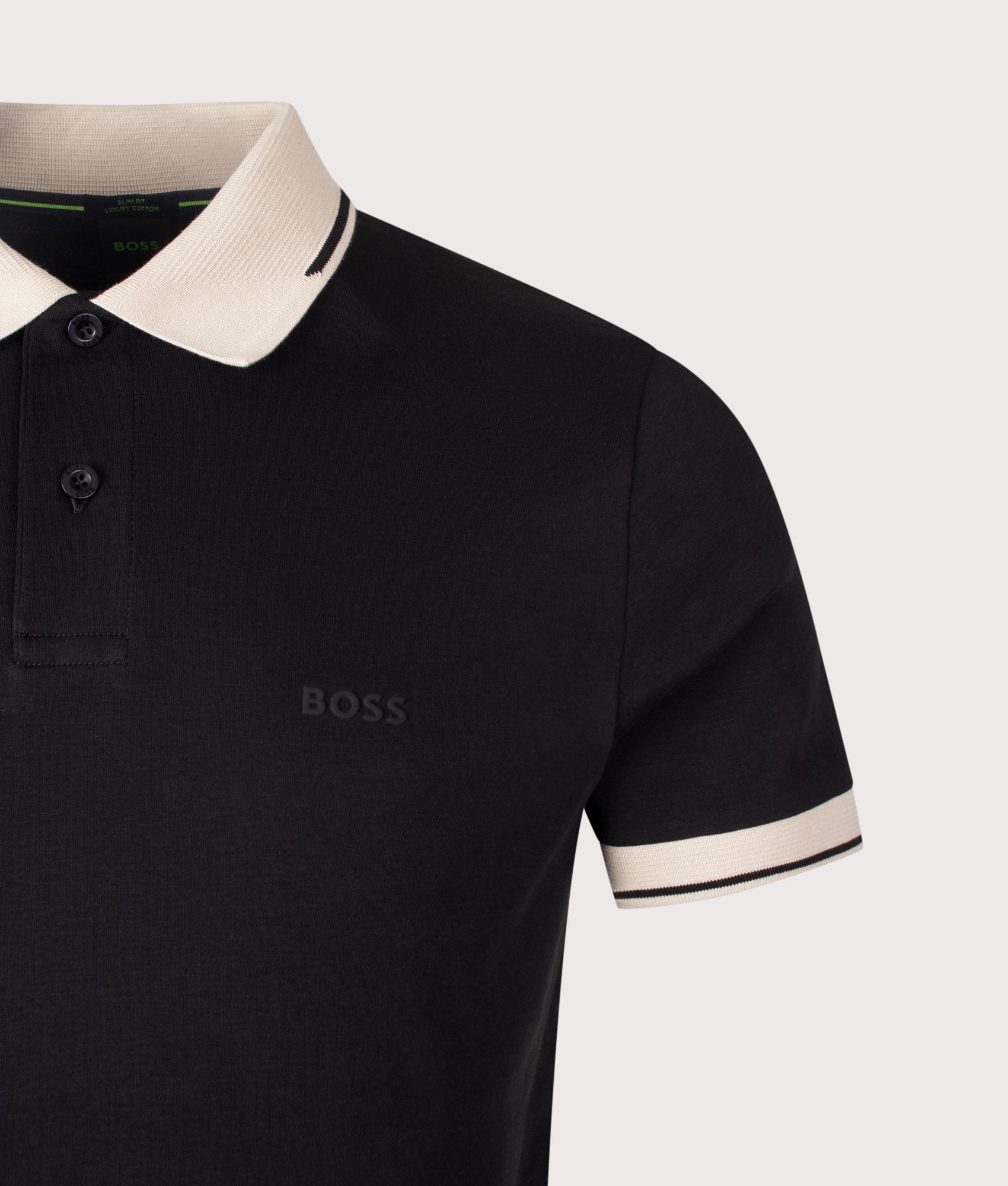 BOSS Slim Fit Network Paule Polo Shirt in Black at EQVVS Menswear. Detail shot.