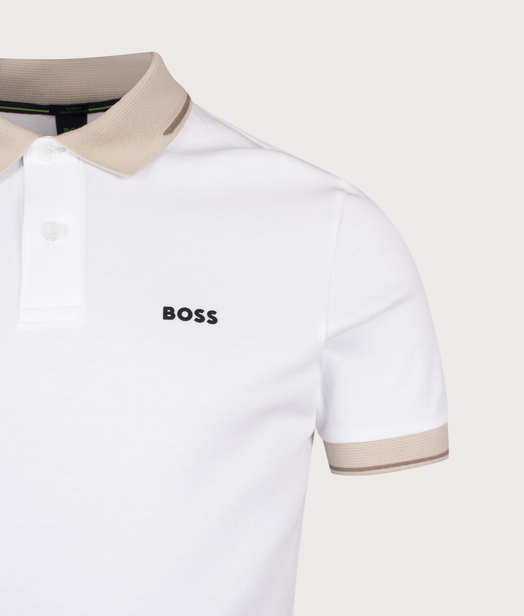 BOSS Slim Fit Network Paule Polo Shirt in White at EQVVS Menswear. Detail shot.