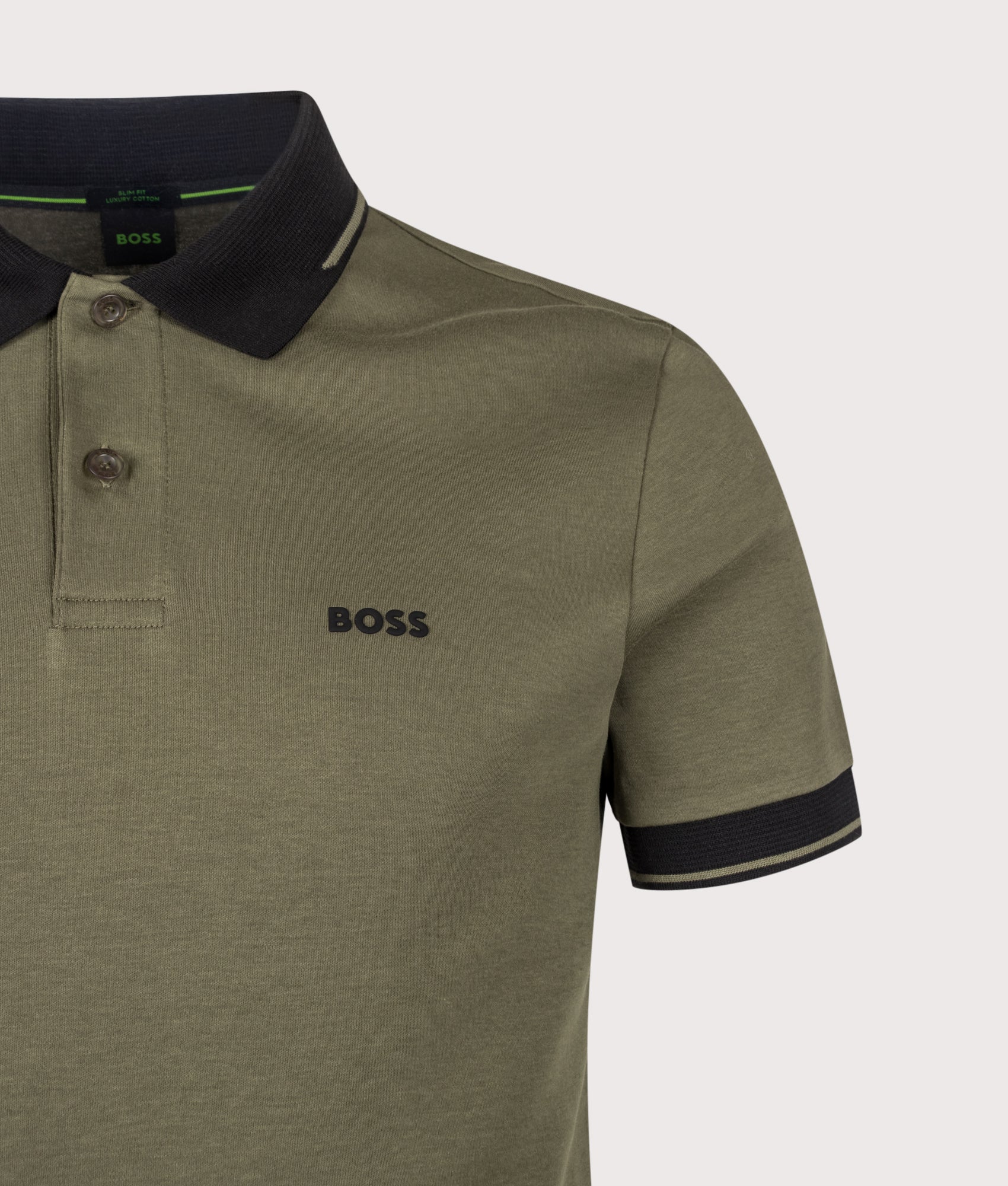 BOSS Slim Fit Network Paule Polo Shirt in Open Green at EQVVS Menswear. Detail shot.