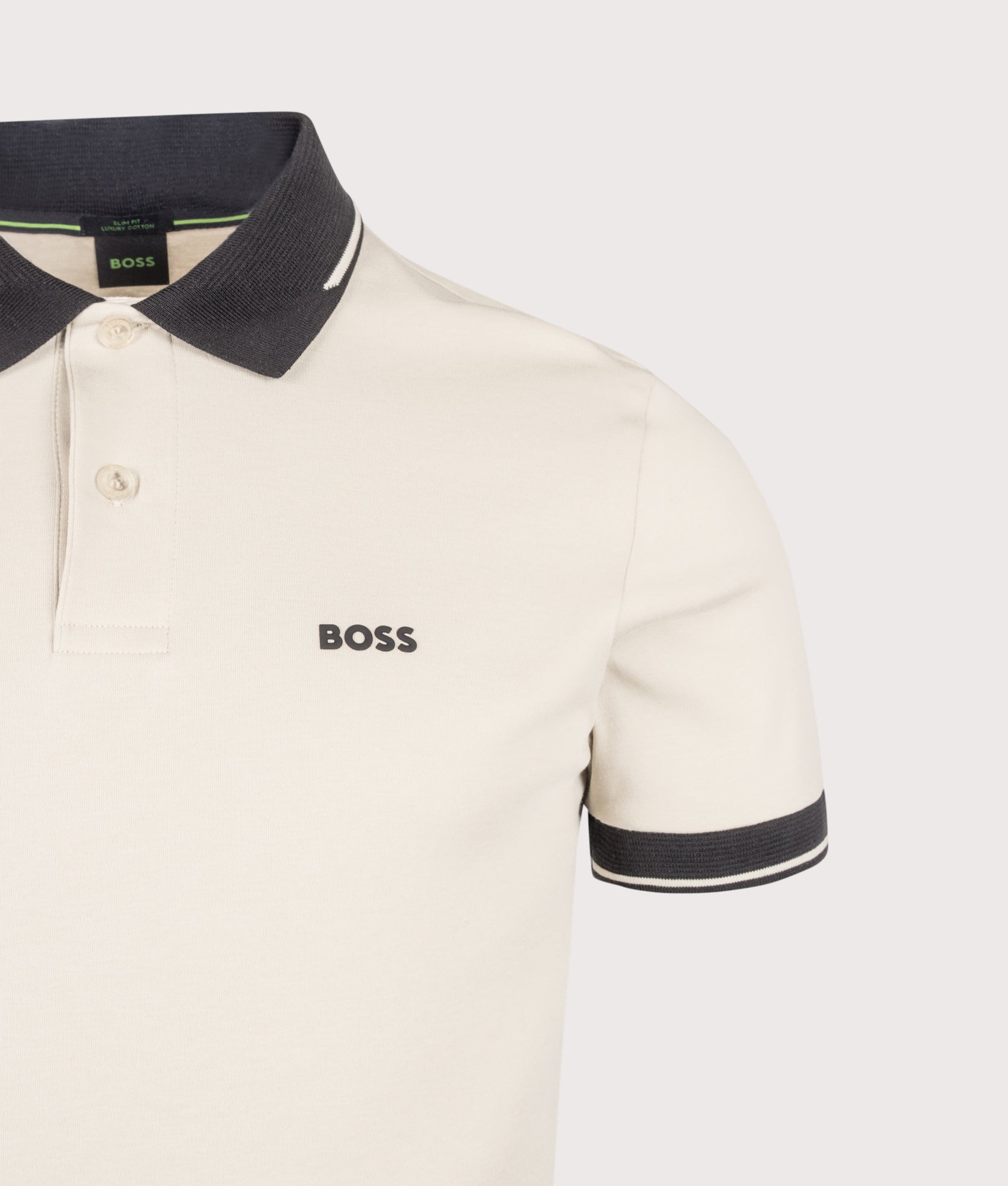 BOSS Slim Fit Network Paule Polo Shirt in Light Beige at EQVVS Menswear. Detail shot.