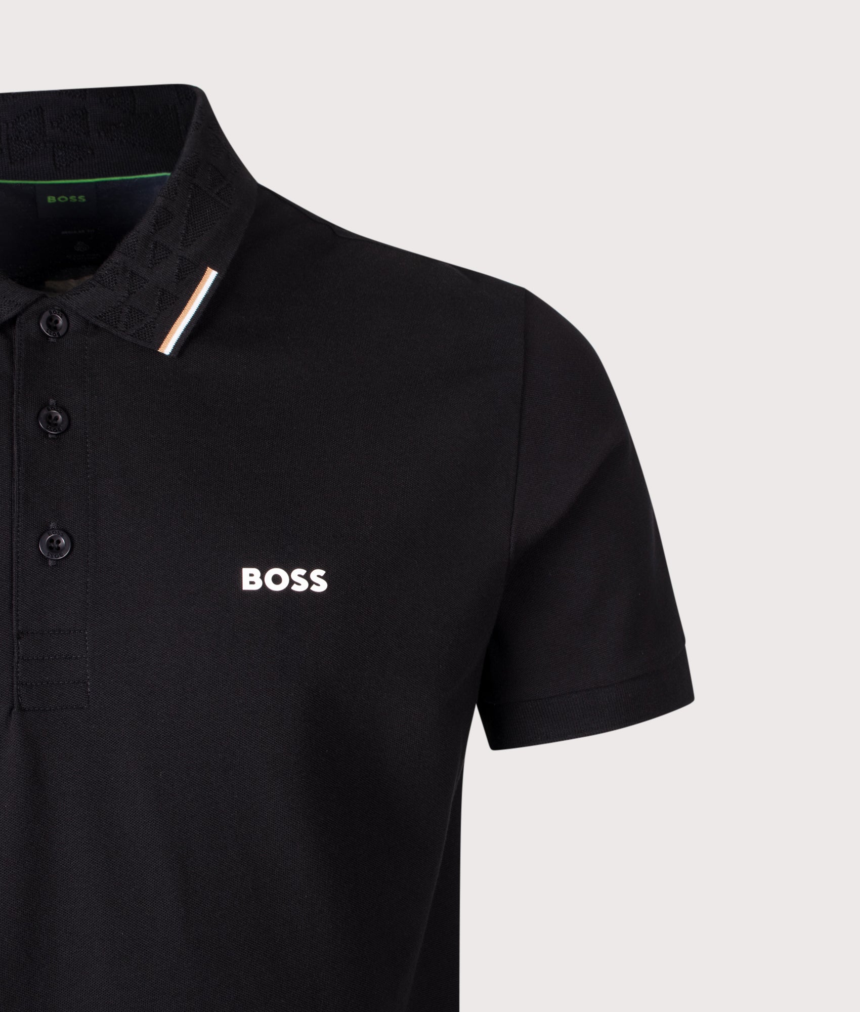 BOSS Swing Paddy Polo Shirt in Black at EQVVS Menswear. Detail shot.